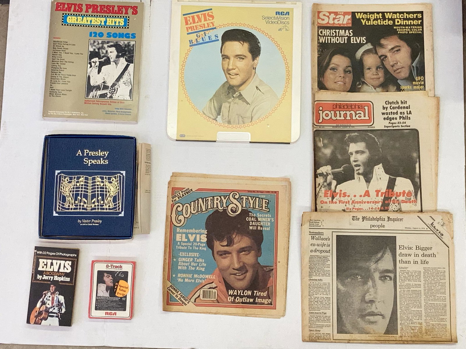 Lot of vintage Elvis memorabilia; newspapers, greatest hits book, misc. books, RCA selectavision (1 of 9)