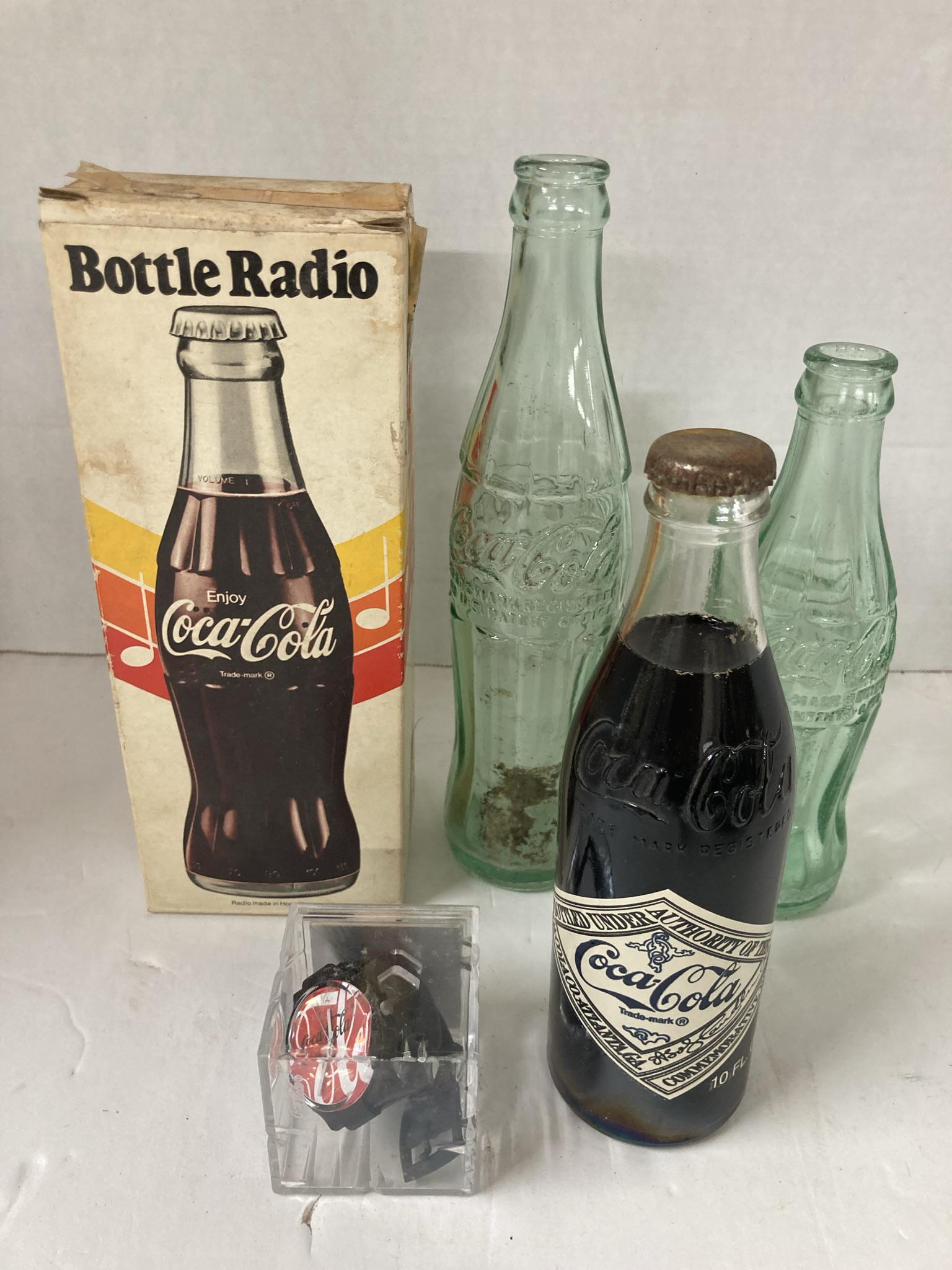 Vintage Lot of Coca-Cola Advertising items: Bottles, Radio, and Watch (1 of 10)
