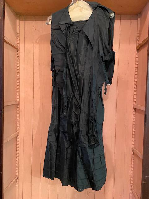 Antique Handsewn Skirt and Vest: Antique Handsewn Skirt and Vest Combo. Black with brown threads. Pleated/tiered detailing on skirt. Small tear on seam. Vest fastens in front. Would be great for theater, film, or re-enactment