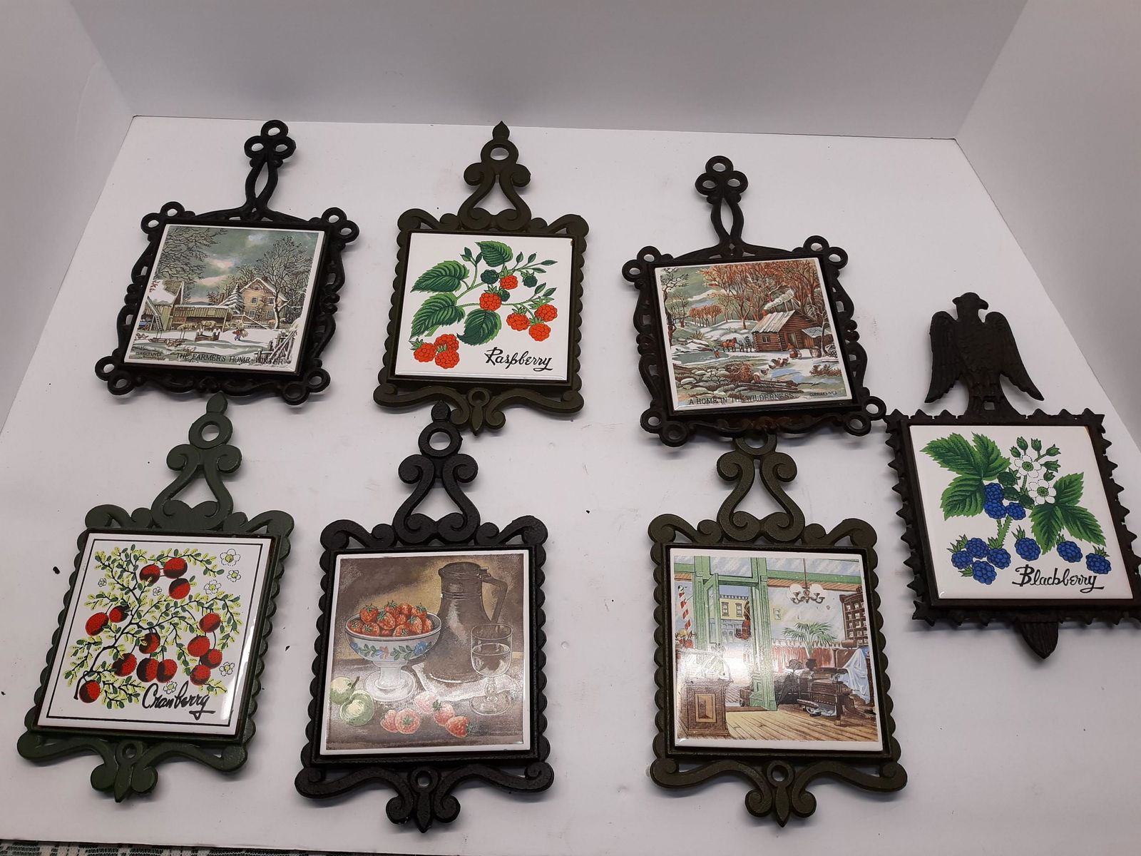Seven Assorted Vintage Cast Iron and Tile Trivets (1 of 8)