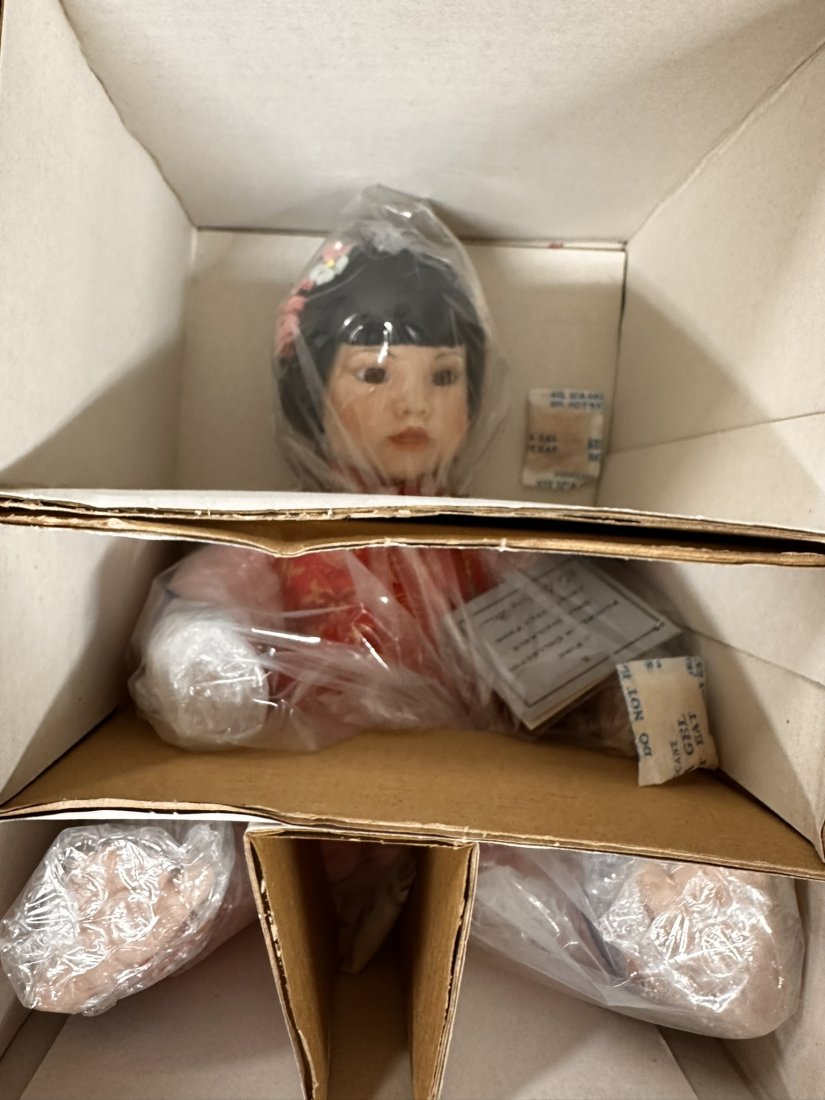 4 Vintage Dolls: Assortment of four vintage dolls.Mei-Mei by Bruce Hsieh.Danbury Mint doll Joshua by FanZan Spanos.Danbury Mint doll the Amish Way by FanZan Spanos.