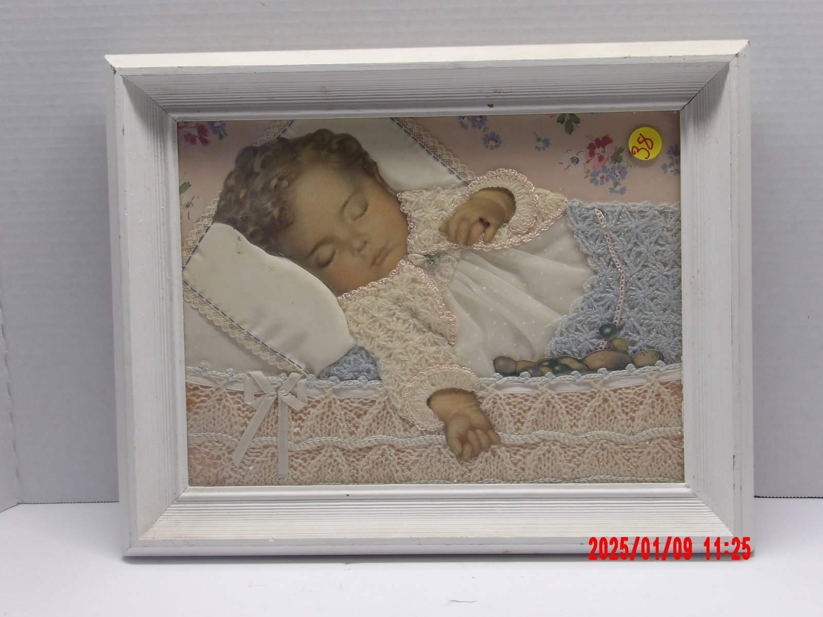 Victorian Mourning Memorial Framed Baby Picture: The blanket featured in the portrait is the same one that once belonged to the grieving baby, symbolizing their memory and presence; Paper doll style, crocheted knitted gown, lace trim accents on pill