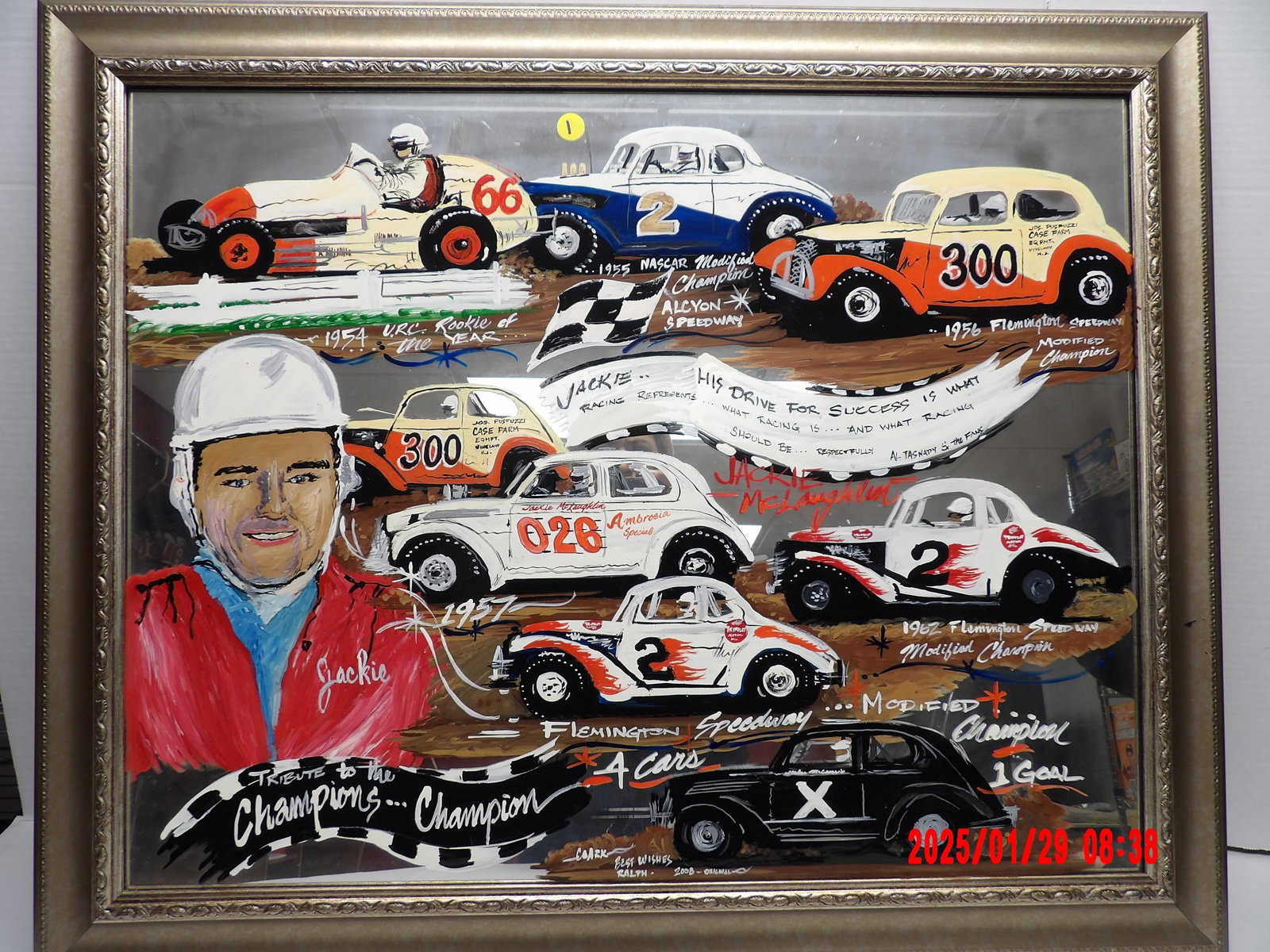 Hand painted “Tribute to the champions” mirror (33.5" x 27"): framed hand-painted tribute artwork on glass, celebrating the career of Jackie McLaughlin, a well-known modified race car driver. The artwork showcases various race cars he drove, painted in a vibrant