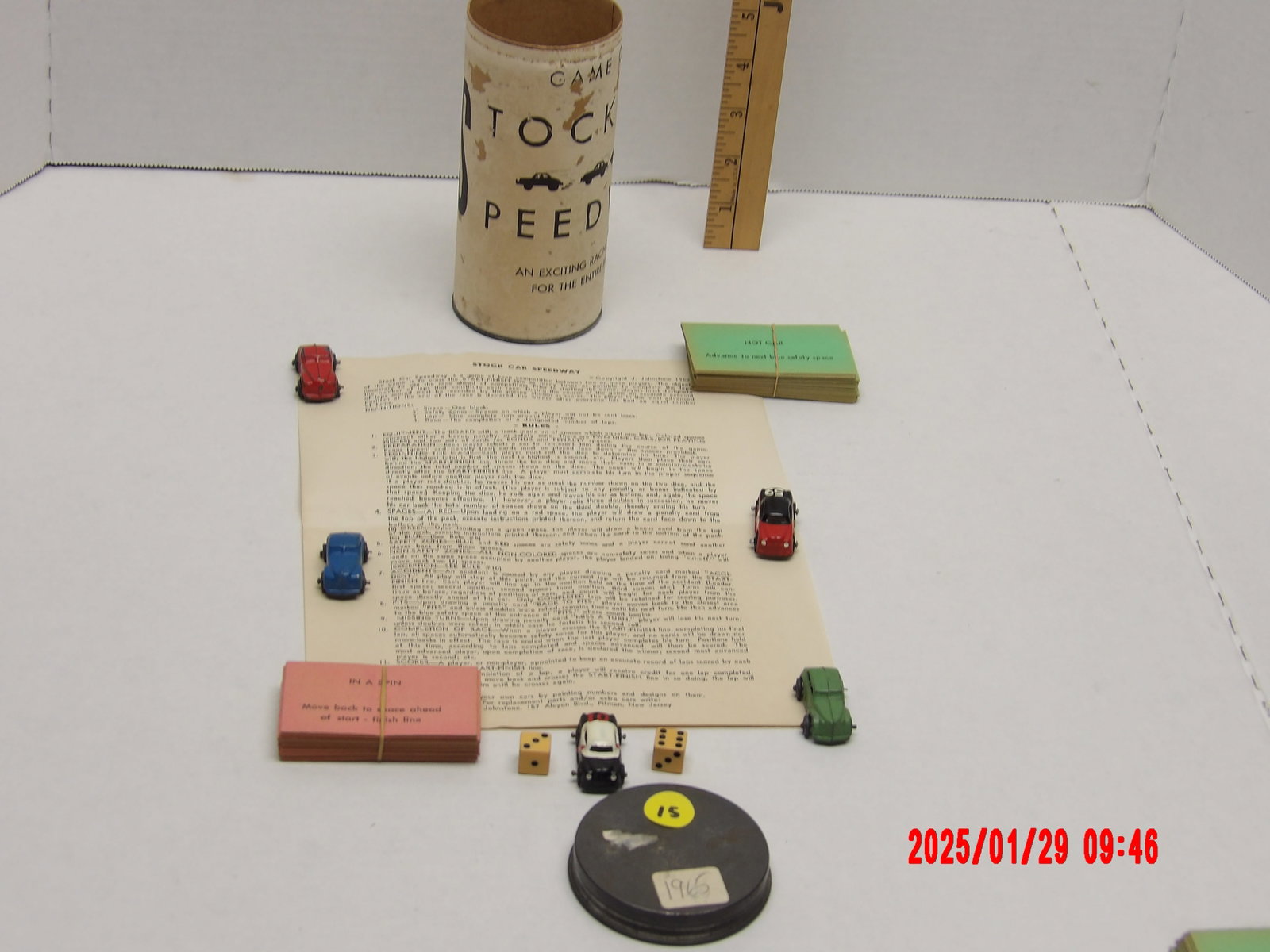 Vintage "Stock Car Speedway" Board Game (1946) (20" x 15"): A vintage tabletop racing game titled "Stock Car Speedway", produced in 1946. The game includes various components such as a game board, miniature race cars, dice, playing cards, and an instruction sh
