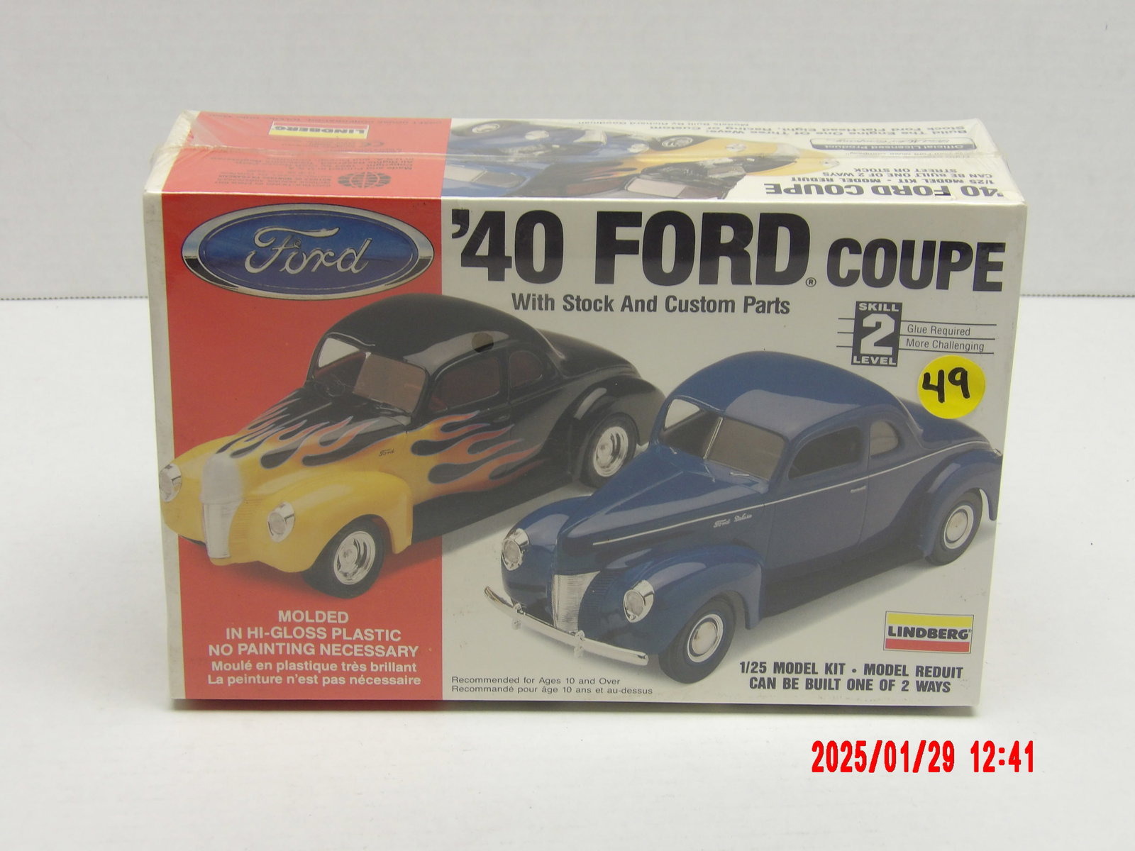 Lindberg 1/25 Scale '40 Ford Coupe Model Kit with Stock and Custom Parts: This Lindberg '40 Ford Coupe model kit offers two build options: custom hot rod or factory stock coupe. The packaging showcases two versions of the model: A yellow and black custom hot rod with flame