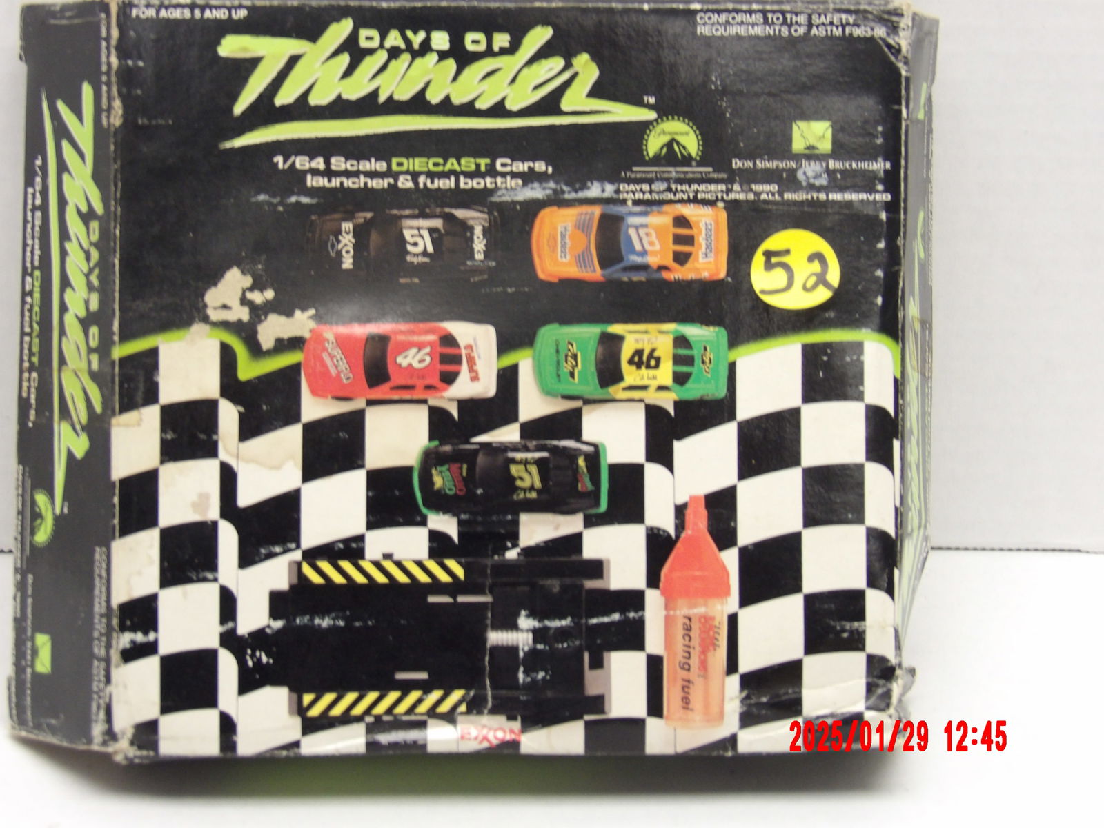 Days of Thunder 1/64 Scale Die-Cast Cars with Launcher & Fuel Bottle – Paramount Pictures (1990): Vintage 1990 Days of Thunder-themed 1/64 scale die-cast car set, featuring multiple race cars, a launcher, and a toy fuel bottle. This collectible is based on the popular 1990 Paramount Pictures film