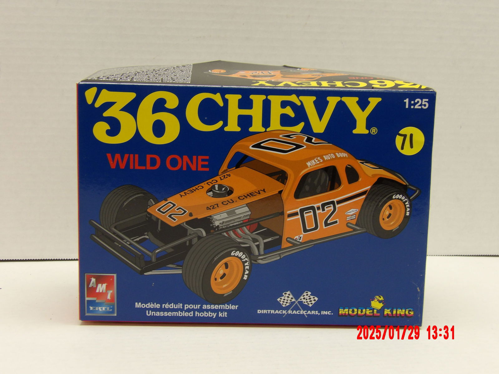 AMT Ertl '36 Chevy Wild One 1:25 Scale Model Kit – Unassembled Hobby Kit: This AMT Ertl '36 Chevy Wild One model kit is a highly detailed representation of a classic dirt track race car, perfect for enthusiasts who appreciate vintage stock car racing. The kit contains every