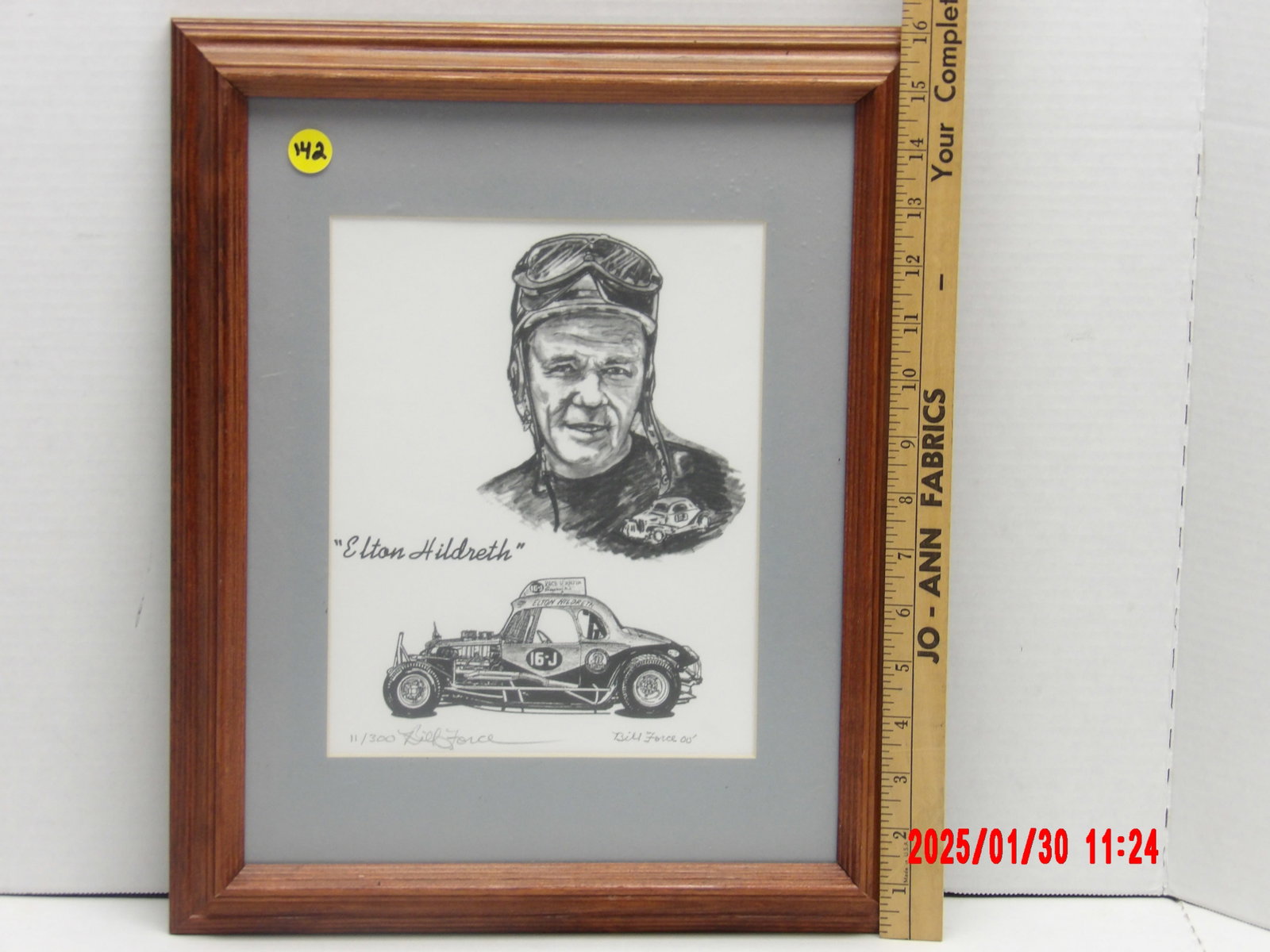 Framed Limited Edition Autograph "Elton Hildreth" Racing Caricature by Bill Force: The artwork is signed by artist Bill Force and is a limited edition print (11/300), making it a unique collector’s item for racing enthusiasts. The close-up image showcases the artist’s signature 