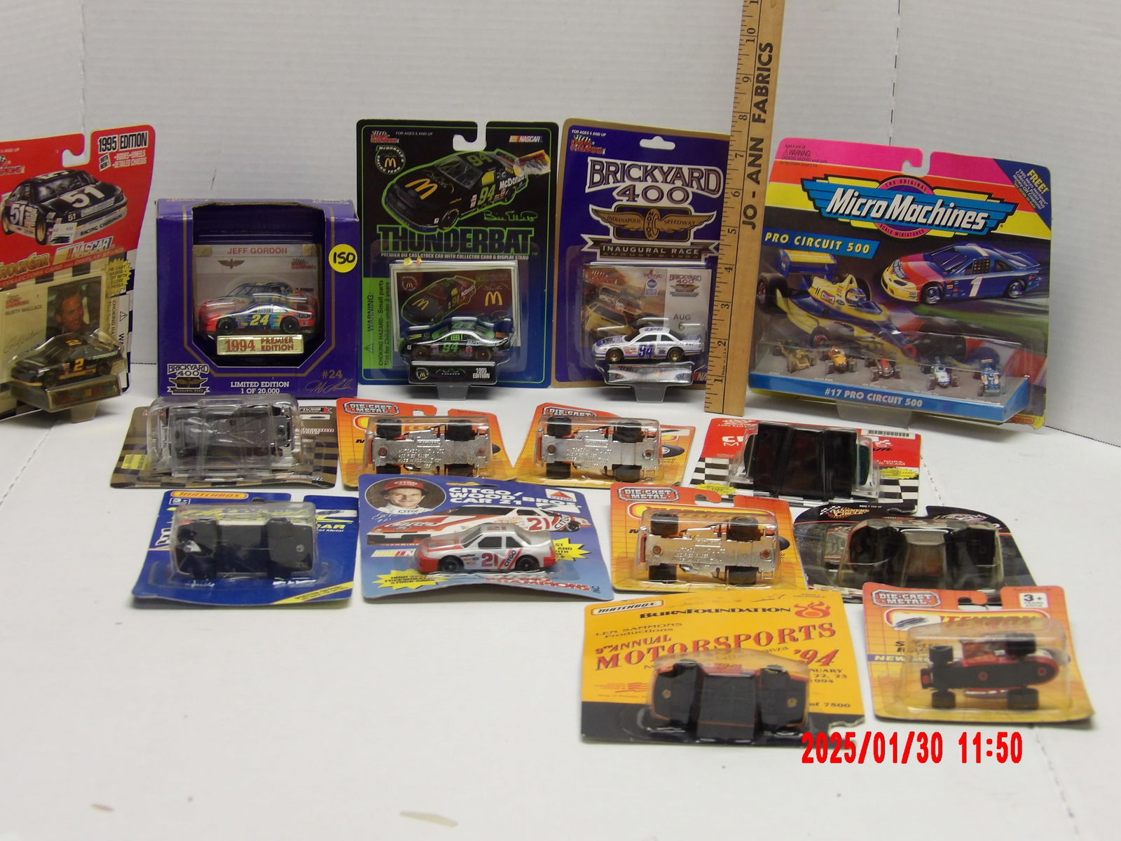 Vintage Racing Die-Cast Cars & Collectibles – NASCAR, Brickyard 400, Micro Machines & More: This lot features a diverse collection of vintage racing die-cast cars and collectibles, including NASCAR models, special edition releases, and Micro Machines racing sets. The assortment includes a mi
