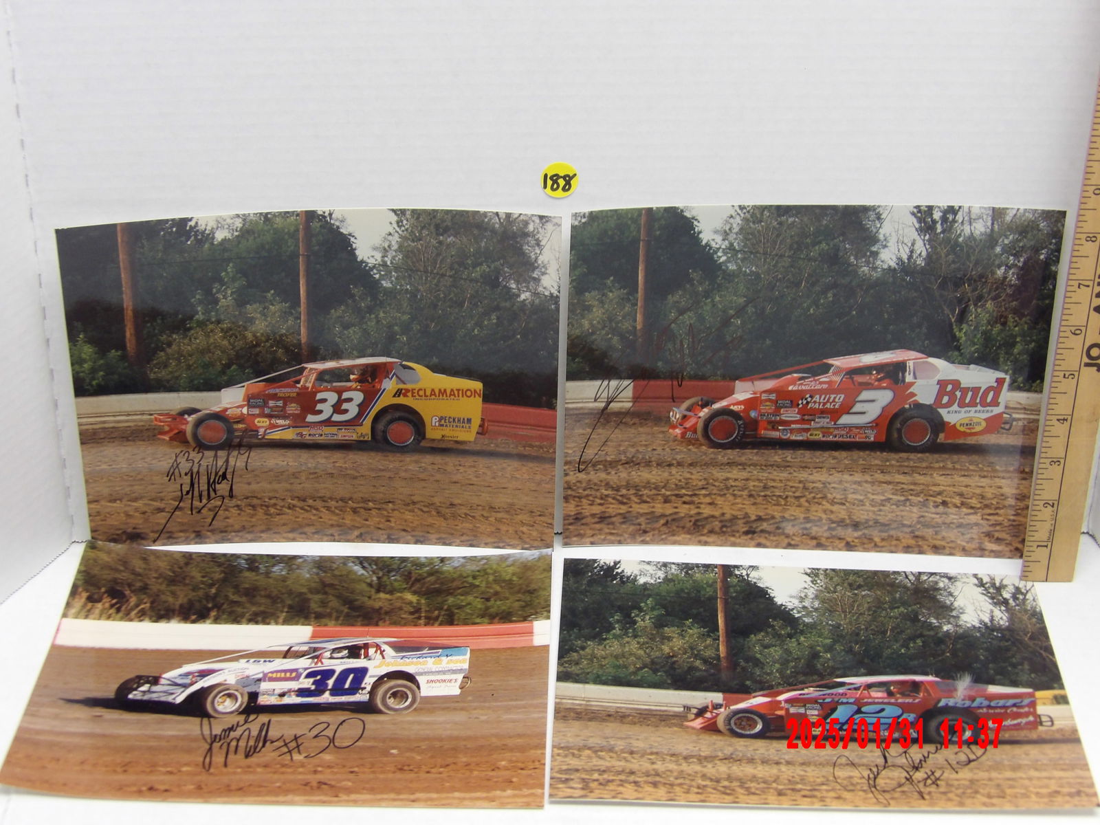Collection of Autographed Dirt Modified Racing Photos: This lot features four autographed action photos of dirt modified race cars, each capturing a different driver on a dirt oval track.Featured Autographs: Jack Johnson autographed action photo of a red