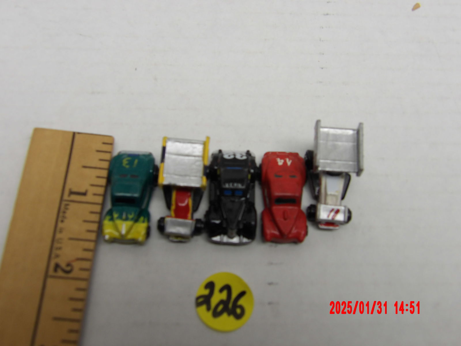 Vintage Miniature Sprint Car Model Collection: This lot features a collection of 5 miniature sprint car models, each uniquely designed with customized paint schemes and numbers. These die-cast or plastic models replicate the classic winged sprint