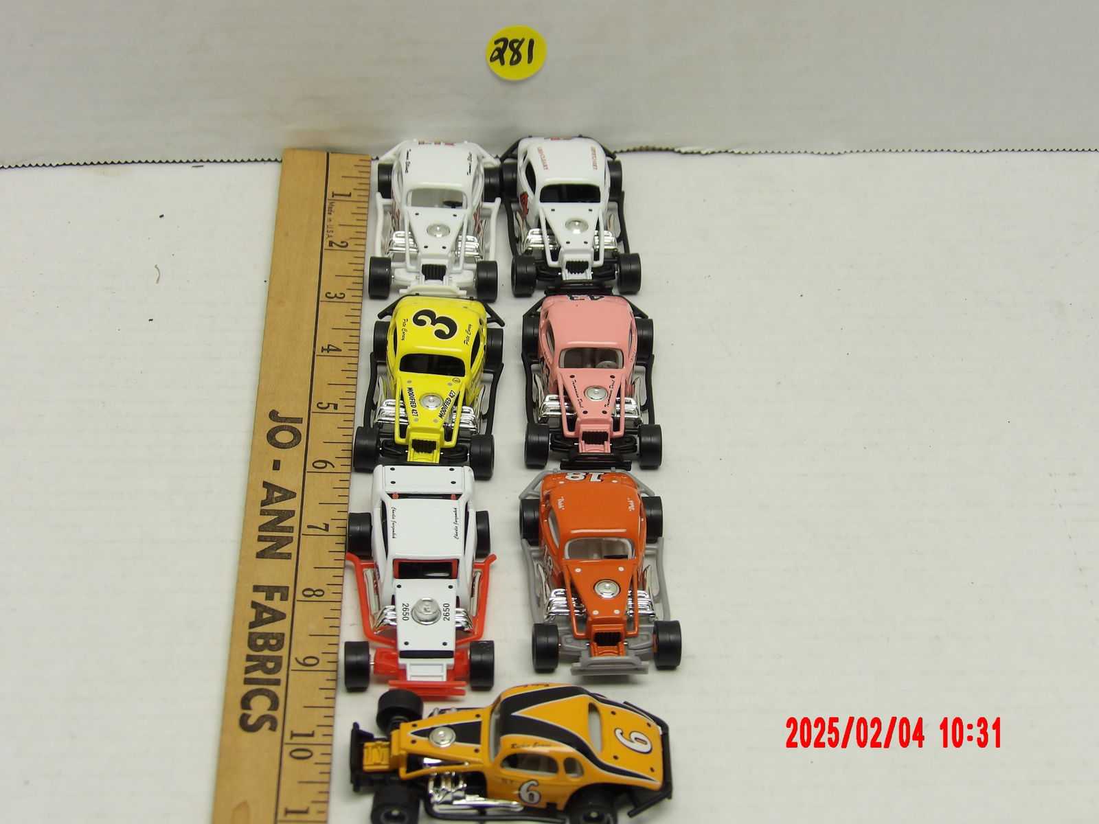 Vintage Modified Stock Mini Car Collection – Classic Short Track Racing Models: This lot showcases a collection of eight mini cars, meticulously designed to replicate classic modified stock cars, which are synonymous with short track racing history in the United States. The cars