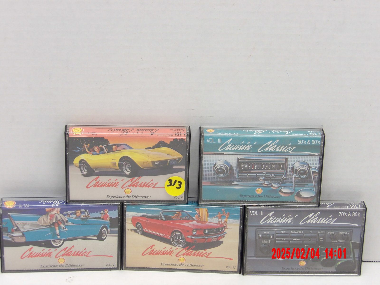Vintage “Cruisin’ Classics” Cassette Tape Collection – Nostalgic Road Trip Music: This photo showcases a collection of five vintage cassette tapes from the Cruisin’ Classics series, a nostalgic music compilation celebrating the golden eras of rock & roll and road trip music. Each