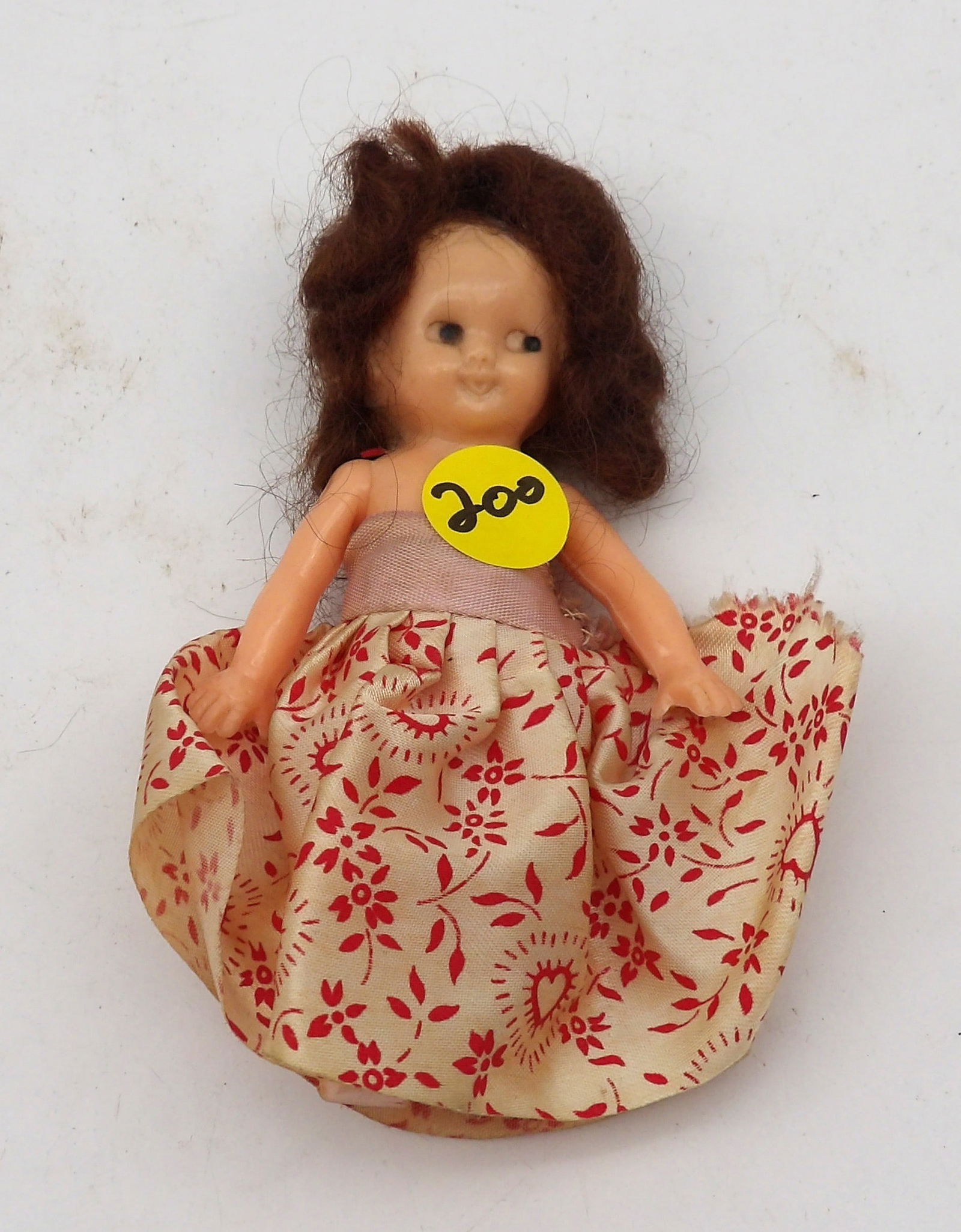 1950’s TRWINK PLASTIC DOLL: This plastic doll has long hair and a floral dress – and is made with the ‘side glancing eye’ design. It is great for doll collectors and those interested in vintage toys.