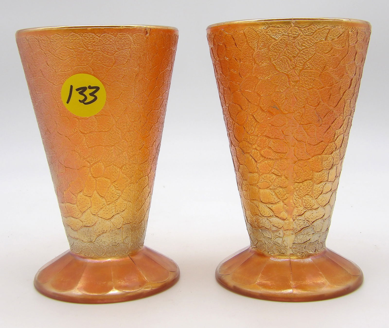 Pair of Crackle MARIGOLD FOOTED TUMBLERS by Jeanette Glass co.: This pair of Jeannette Glass "Crackle Marigold" footed tumblers is notable for its brilliant color and design. They are highly prized by collectors.