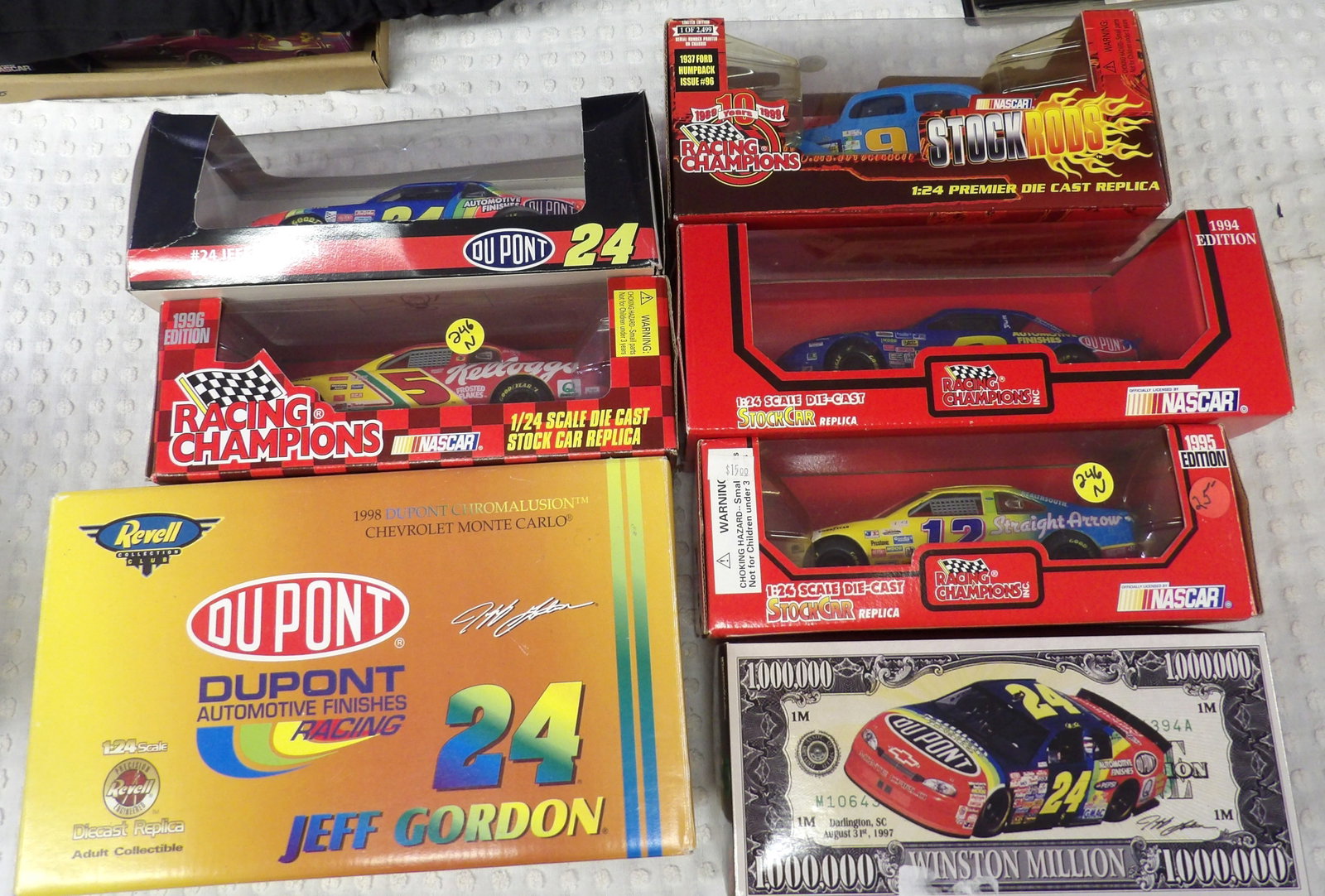 DIE CAST RACE CARS NASCAR (7): These die cast 1:24 scale race cars are from the 1990’s and include Racing Champions and Revell brands. Several cars feature legendary driver Jeff Gordon.