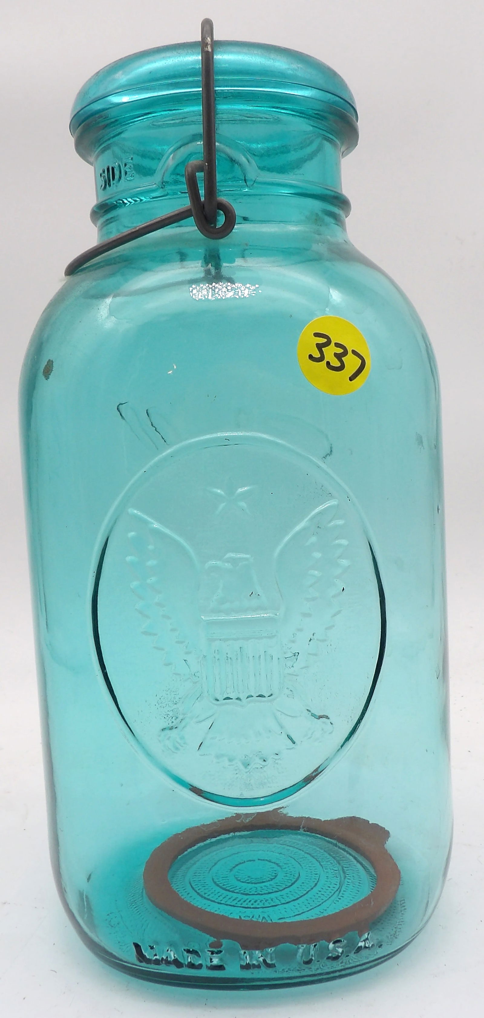 BALL IDEAL FEDERAL BLUE GLASS JAR: This vintage Ball Ideal Canning Jar is recognizable by its distinctive "Ball Blue" color and wire bail closure system. (9.5” X 4.5”)