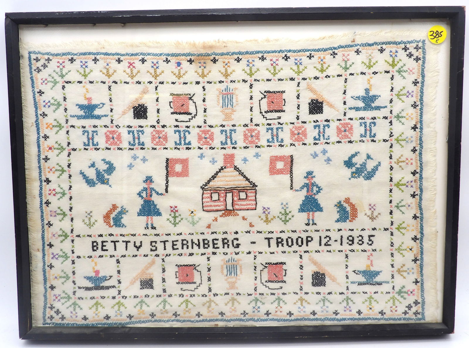 FRAMED GIRL SCOUT NEEDLEWORK SAMPLER: The sampler was created by Betty Sternberg of Troop 12 in 1935. Samplers were traditionally used as a tool for teaching young girls needlework and literacy skills, often serving as a demonstration of