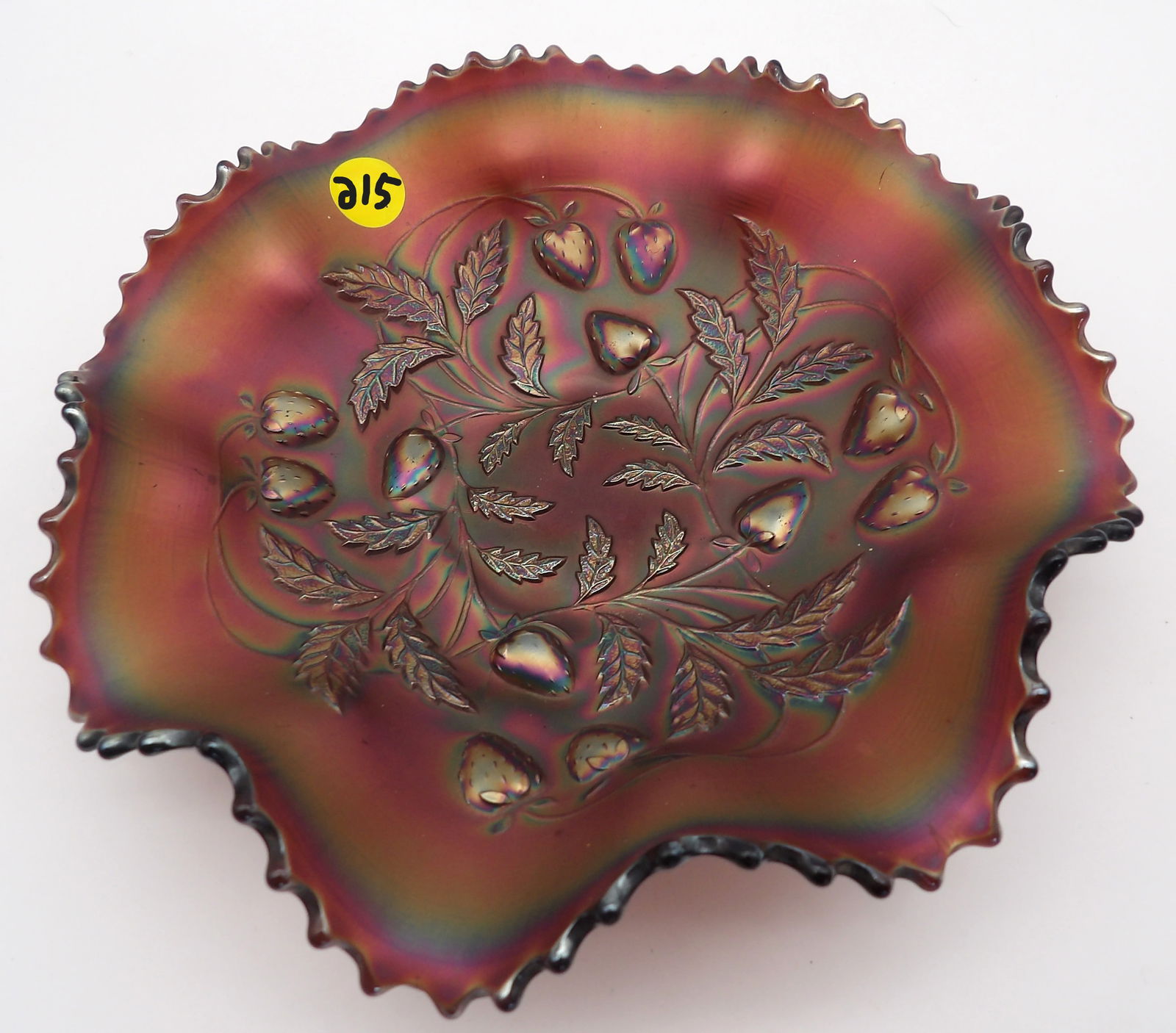 STRAWBERRY & LEAF AMETHYST BASKETWEAVE RUFFLED GLASS BOWL BY NORTHWOOD: This piece is a beautiful example of Northwood’s iridescent glass. The amethyst Strawberry bowls are especially desirable among collectors.