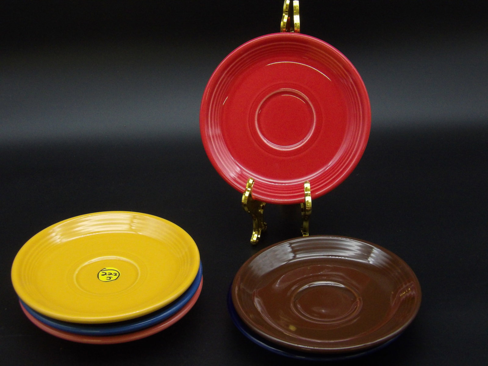 FIESTAWARE SAUCERS (6): This lot of 6 collectible Fiestaware saucers comes in Sunrise Yellow, Peacock, Scarlet, Rose Pink, Cobalt Blue, and Chocolate colors