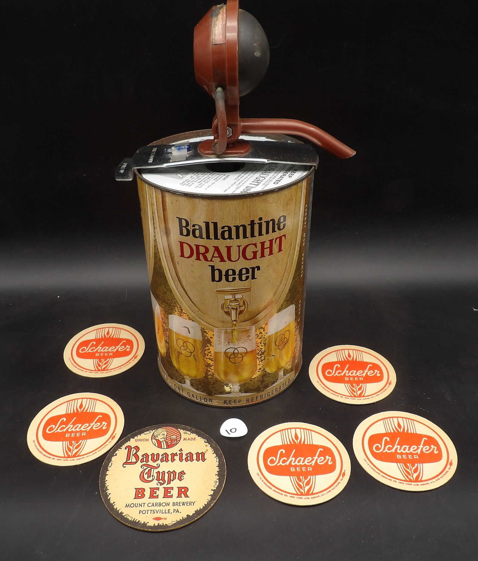 Ballantine Draught Beer 'Keg' Can w/ Pump & Vintage Beer Coasters (6): This vintage beer lot includes a Ballantine Draught 'Keg' can with pump attached. It also includes six vintage coasters featuring Shaefer & Bavarian-Type Beer brands.Measures:14" x 6"