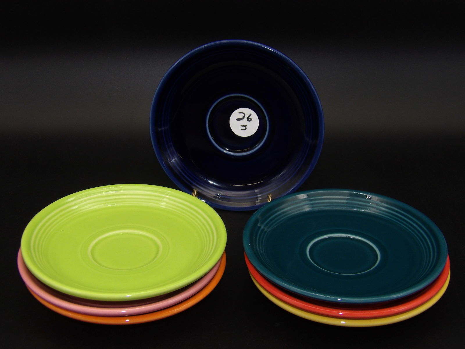 Fiesta Dinnerware Classic Rim Saucers (7): This lot of 7 classic-rim Fiestaware saucers comes in Tangerine, Cobalt, Chartreuse, Juniper, Flamingo, Persimmon, and Sunflower.Measures:6"