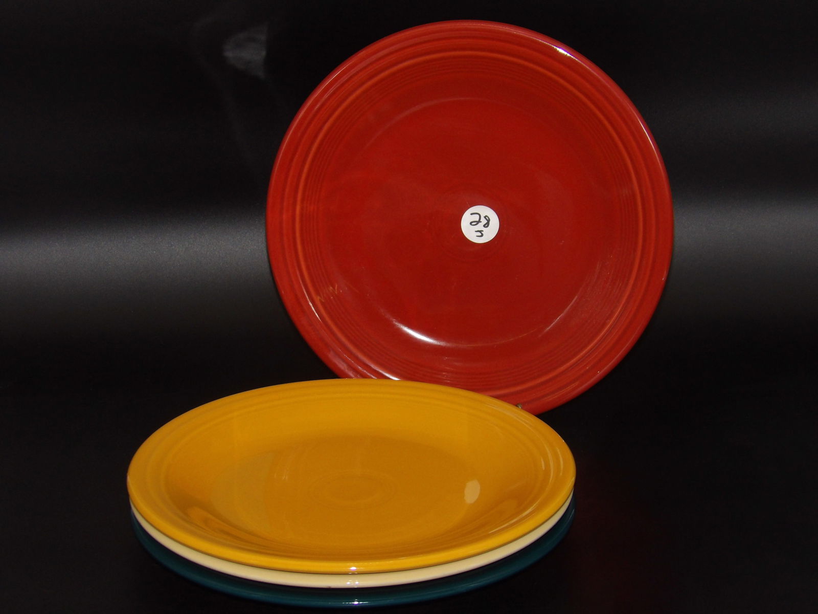 Fiesta Dinnerware Plates (4): This lot of 4 Fiesta Dinnerware plates comes in Poppy, Juniper, Ivory, and Yellow glazes. Notice glaze mark.Measures:10.5"