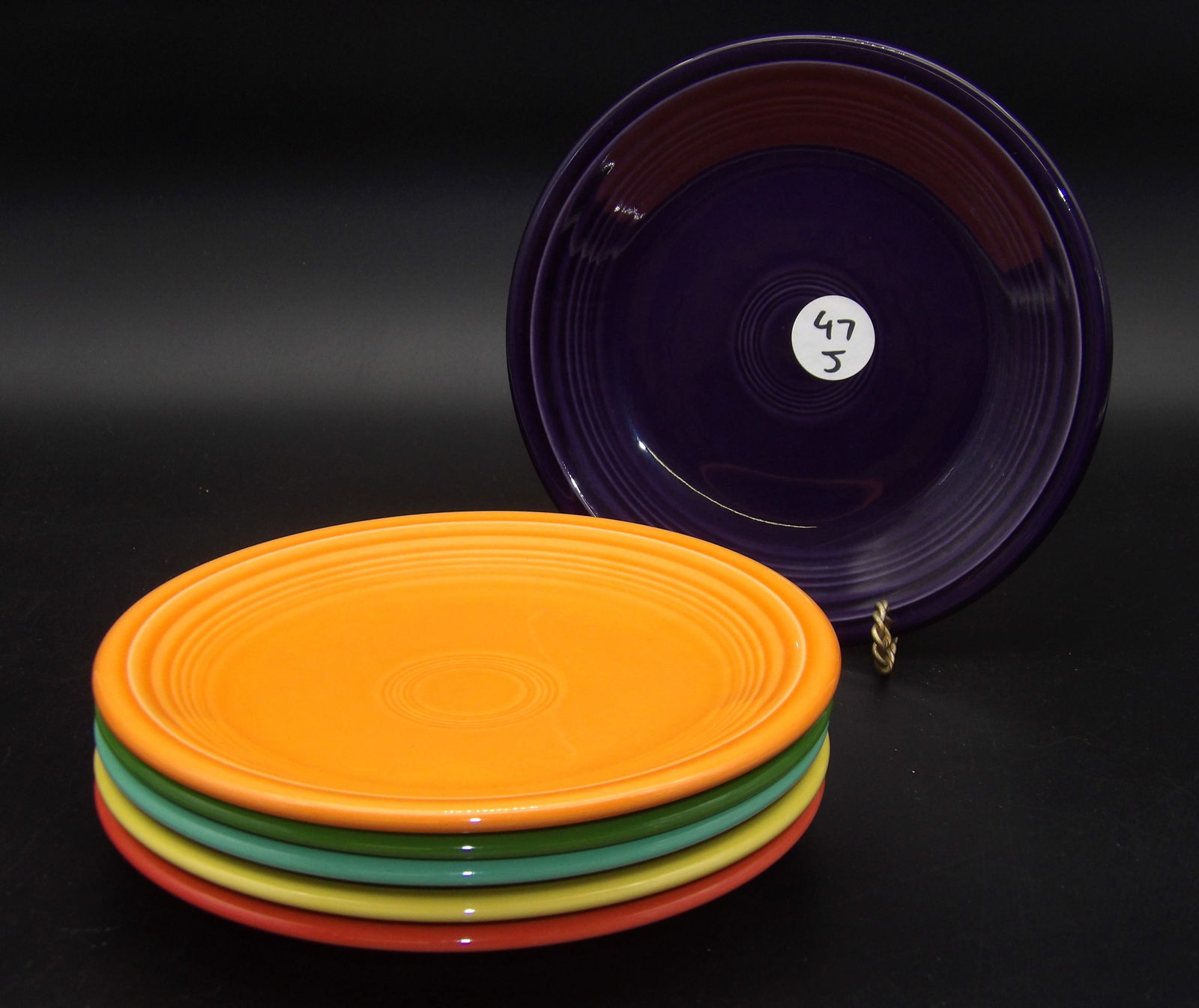 Fiesta Dinner Plates (6): This lot of 6 Fiestaware dinner plates comes in the Persimmon, Shamrock, Yellow, Tangerine, Sea Mist Green, and Plum glazes.Measures:7"
