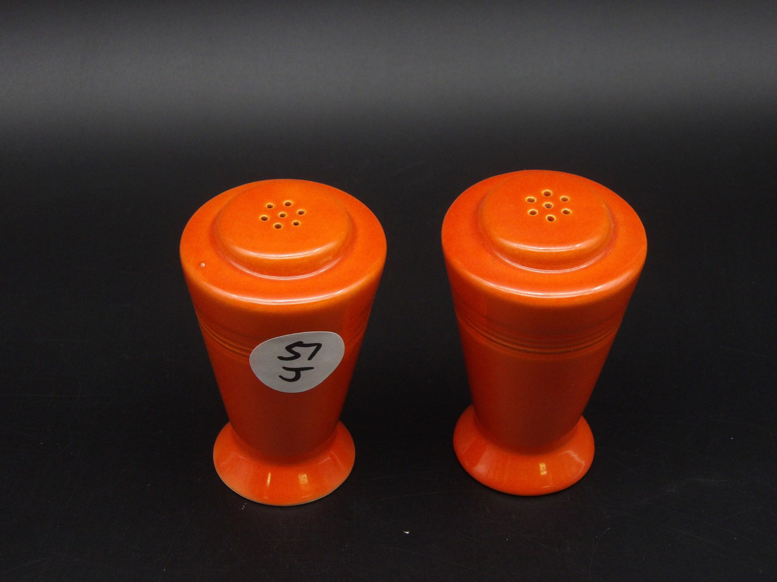 Homer Laughlin Harlequin Salt & Pepper Shakers: This set of Homer Laughlin Harlequin salt & pepper shakers comes in the Red-Orange glaze.Measures:3.5" x 2"