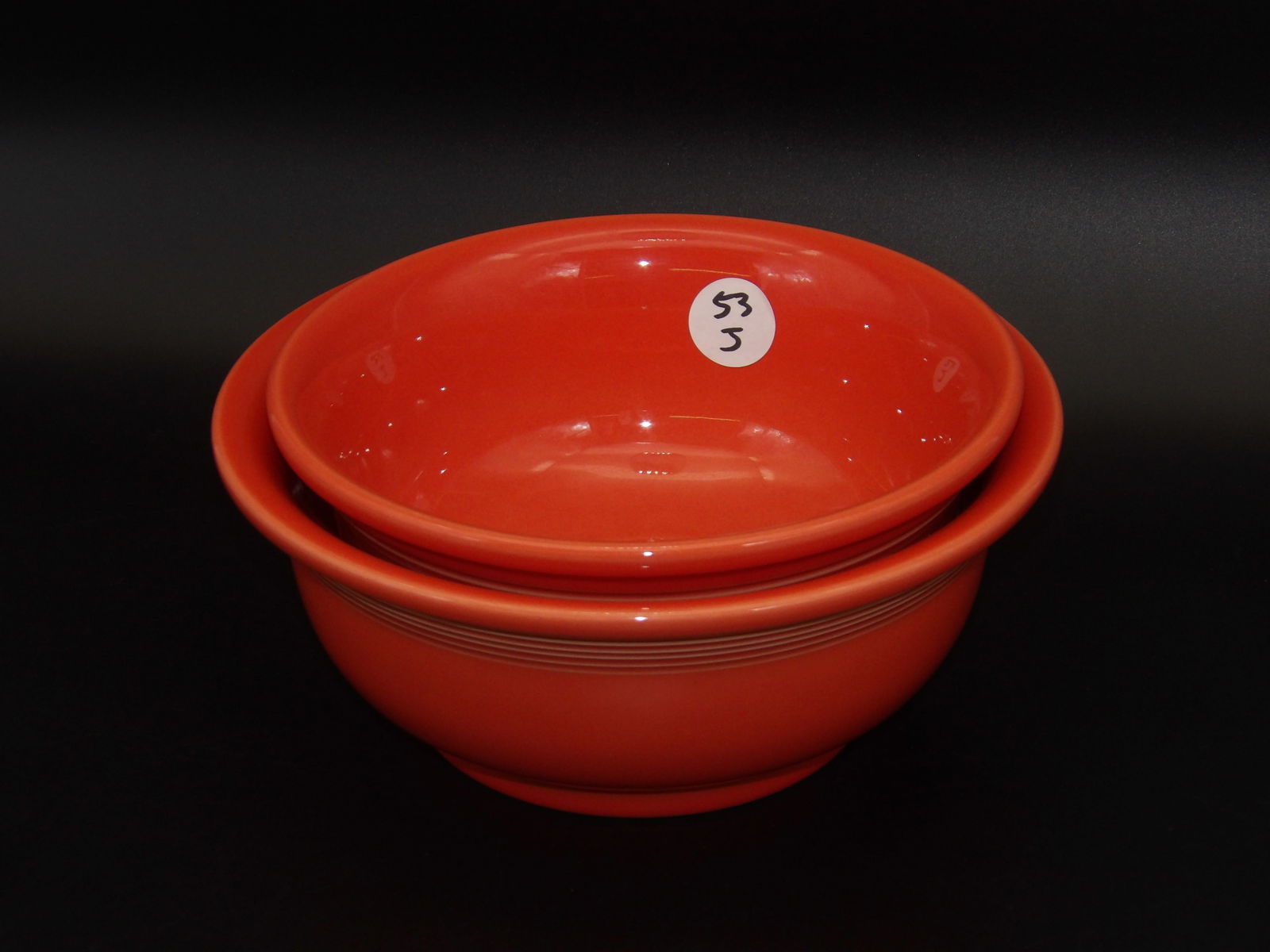 Fiestaware Mixing Bowls (2) - Poppy: This pair of Fiestaware mixing bowls comes in the Poppy glaze.Measures:3.5" x 9" , 3.5" x 8"
