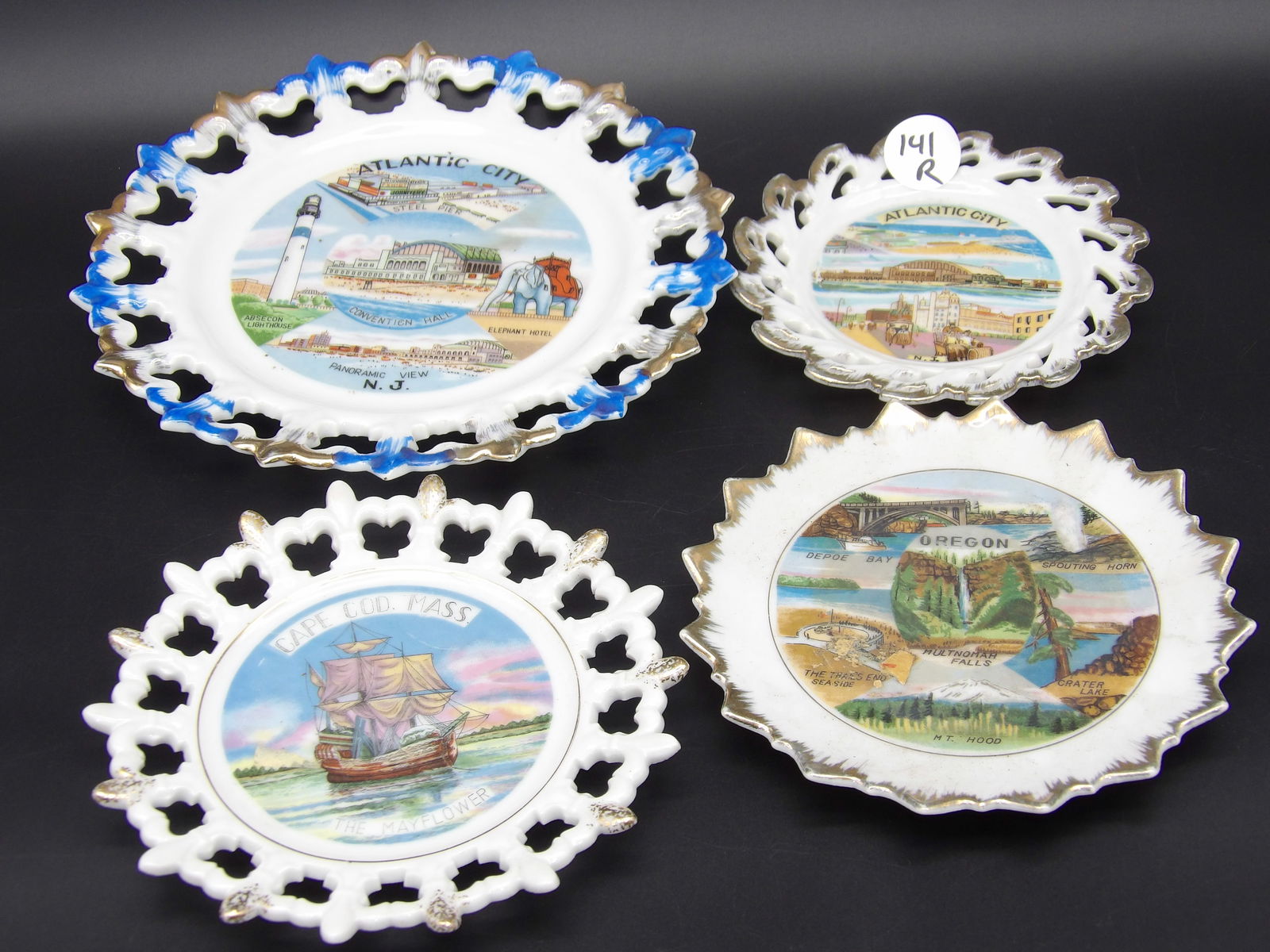 Open Lace Souvenir Plates (4): This lot of 4 open lace plates are souvenirs featuring popular locations such as Atlantic City, Oregon, and Cape Cod.Measures:5", 6"