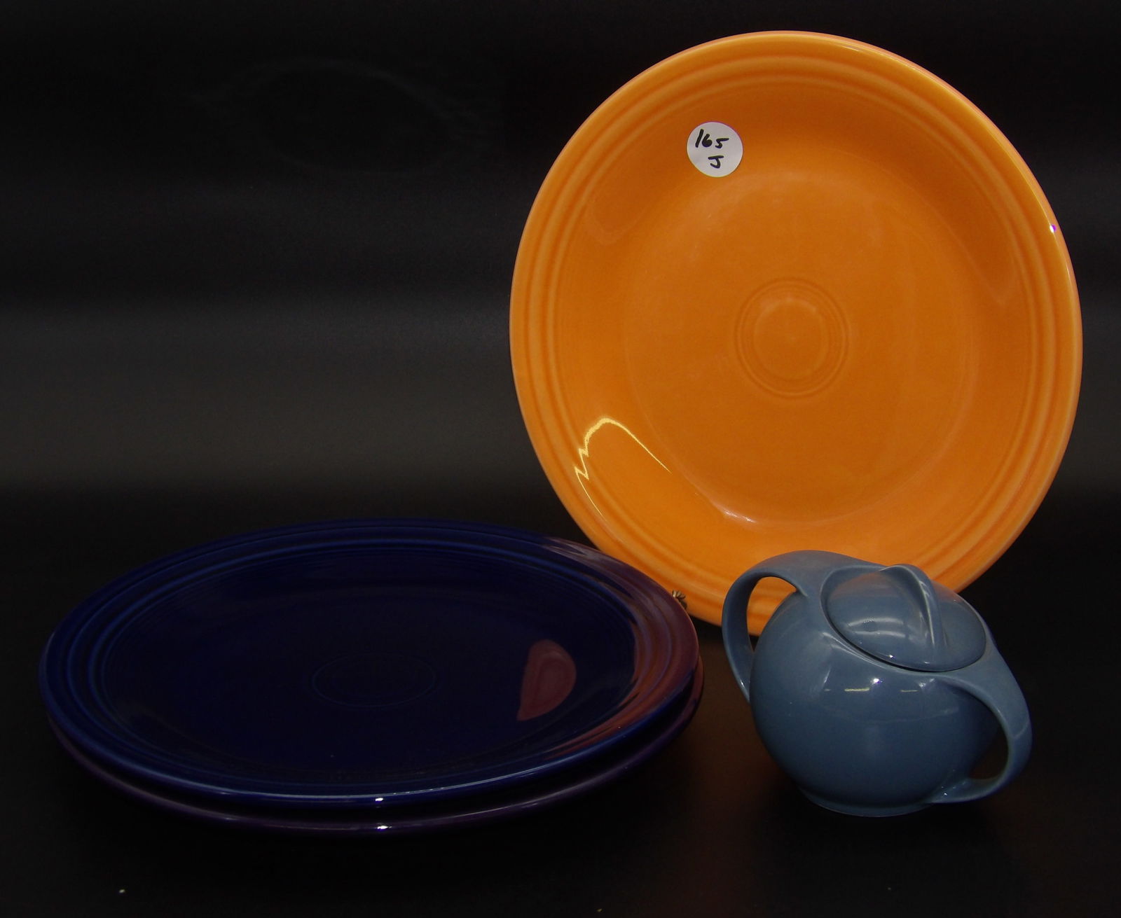 Fiestaware Dinner Plates (3): This trio of Modern-Era Fiestaware dinner plates comes in Persimmon, Cobalt, and Plum color glazes.Measures:10.5"