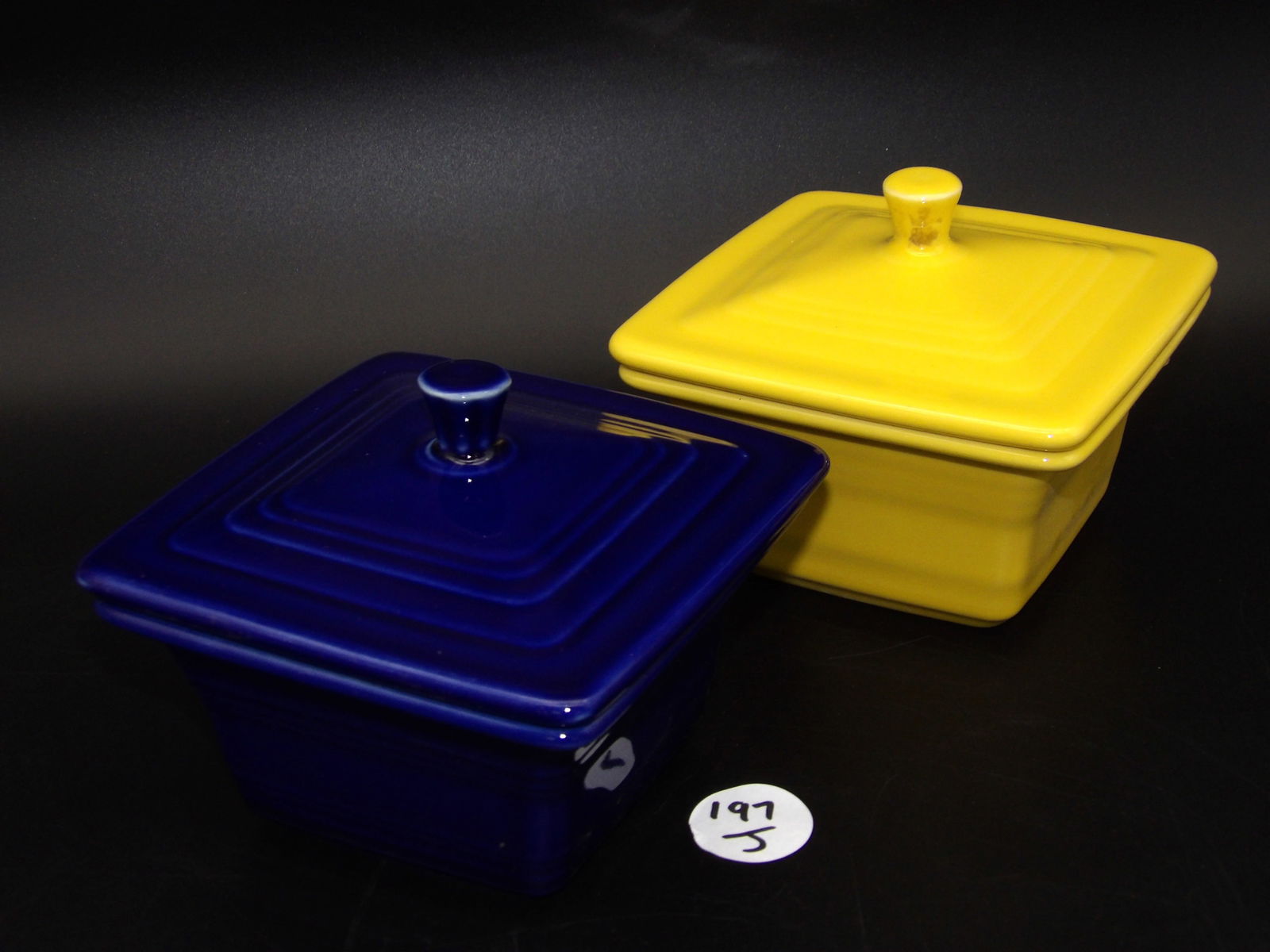 Fiesta Covered Boxes (2): This pair of New-In-Box Fiestaware covered boxes comes in Sunflower (1444 - 320) and Twilight (1444 - 346).Measures:4" x 5" x 5.5"