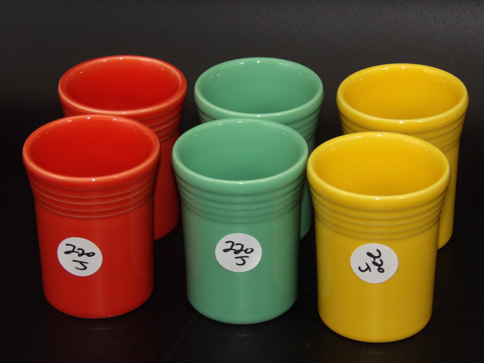 Fiesta Tumbler Cups (6): This collection of 6 Modern-Era Fiesta tumbler cups comes in Persimmon, retired Sea Mist Green, and Yellow. Measures 4" x 3"