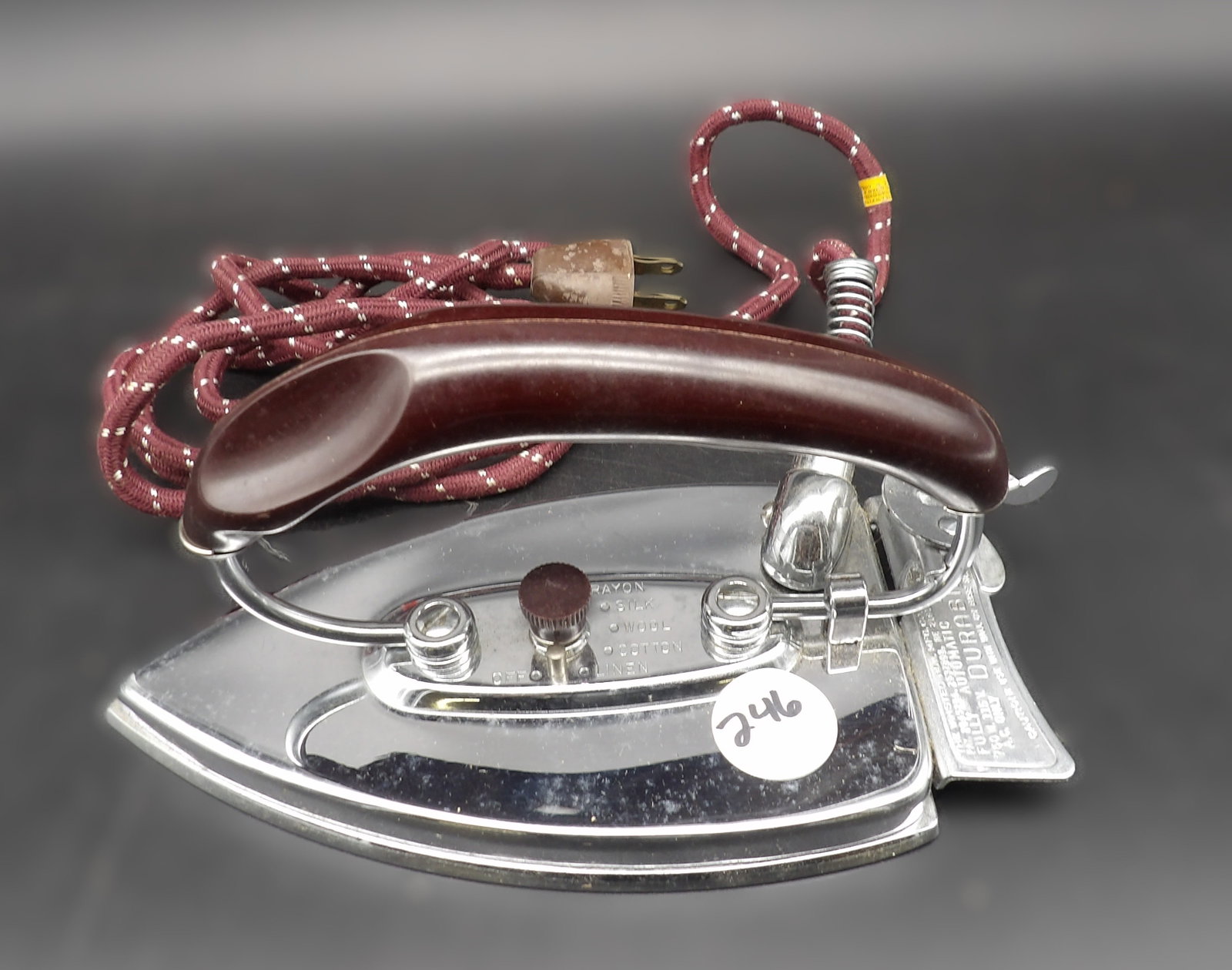 Durabilt Folding Travel Iron: This folding electric dry iron has a chrom-plated soleplate and is designed for use while travelling. Measures 5" x 8" x 4"