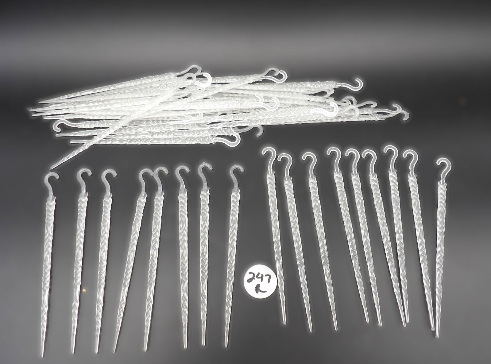 Vintage Glow-In-The Dark Plastic Icicle Christmas Ornaments (approx 100): This group of nearly 100 vintage plastic icicle ornaments glows in the dark. Measures 5.5" each