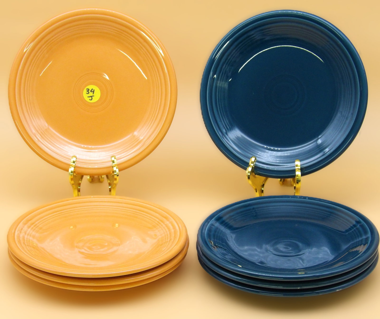 Fiestaware Plates (8): This lot of 8 Fiestaware plates comes in Juniper and Tangerine glazes. Modern era. Measures: 7" each