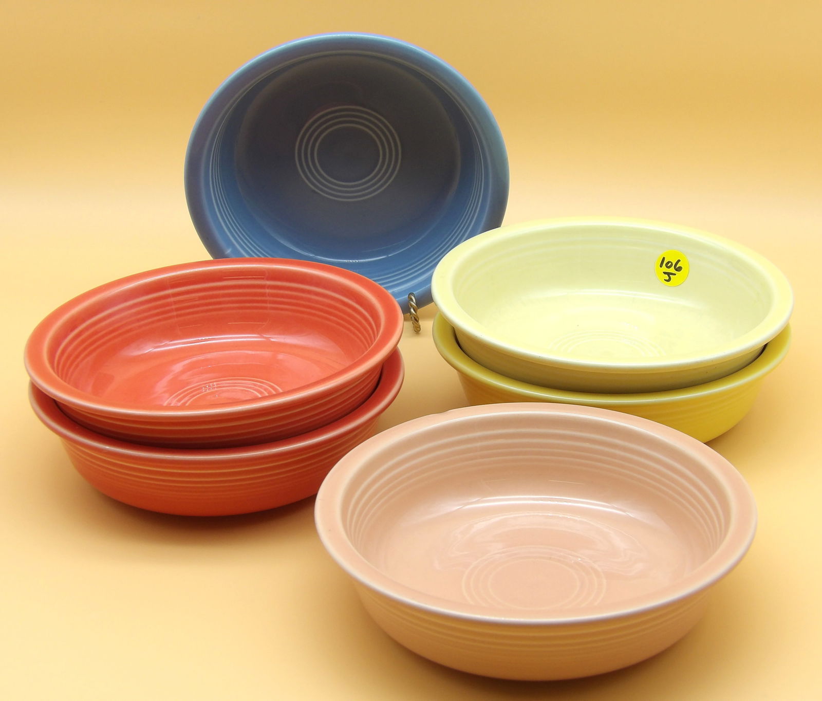 Fiestaware Bowls (6): This lot of 6 modern-era Fiestaware bowls comes in Old Ivory, Yellow, Persimmon, Periwinkle, and Peach glazes. Measures: 2" x 7"