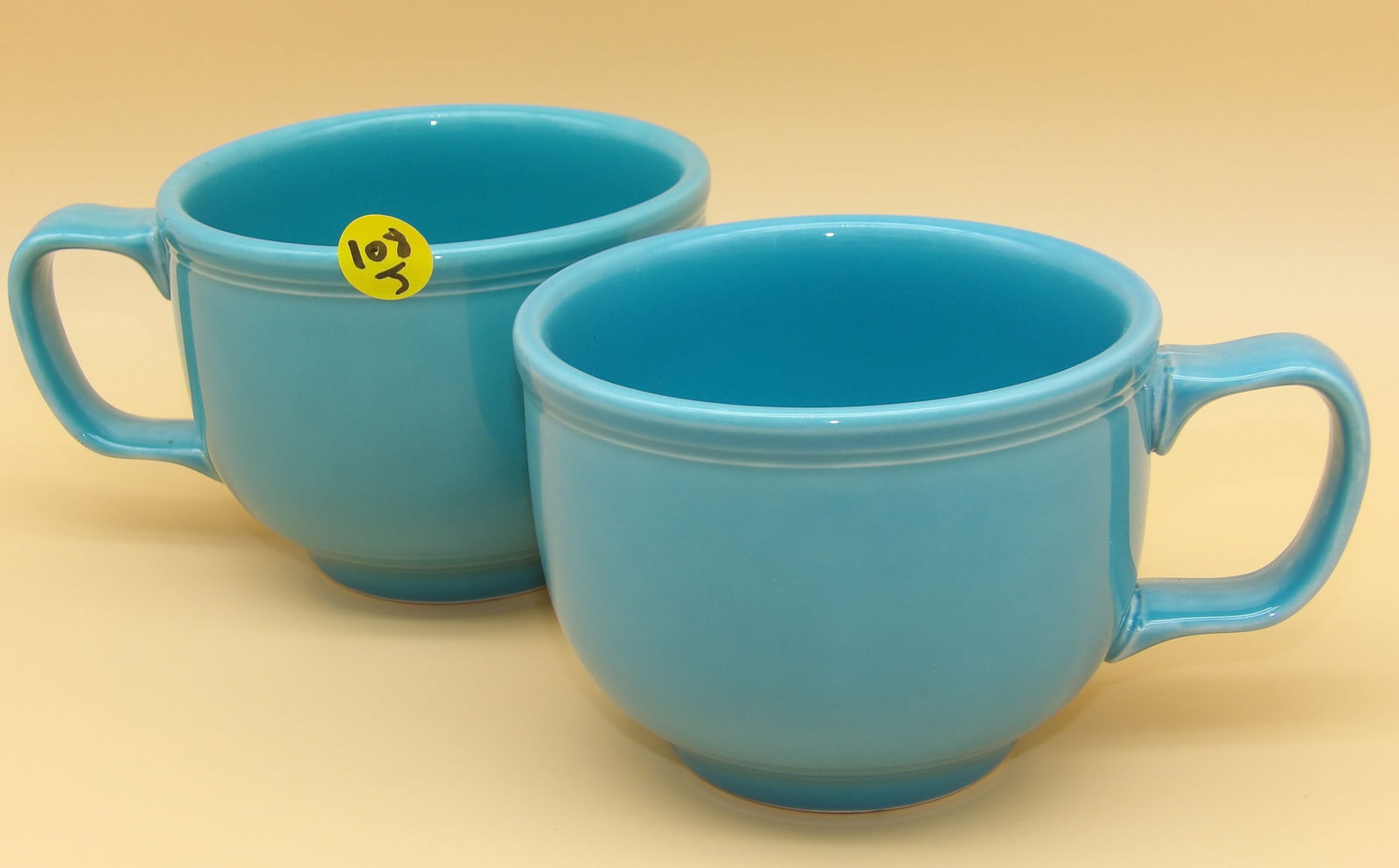 Homer Laughlin Jumbo Cups (2): This pair of vintage Homer Laughlin 'Jumbo' cups comes in Turqouise glaze. Measures: 3.5" x 6" x 4.5"