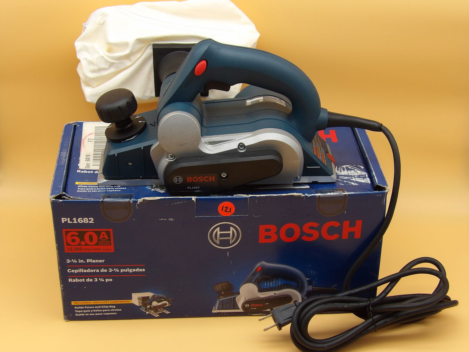 Bosch Planer (In Box): This Bosch planer comes new, unopened in the box - and includes guide fence and chip bag. Measures: 7" x 15.5" x 7"