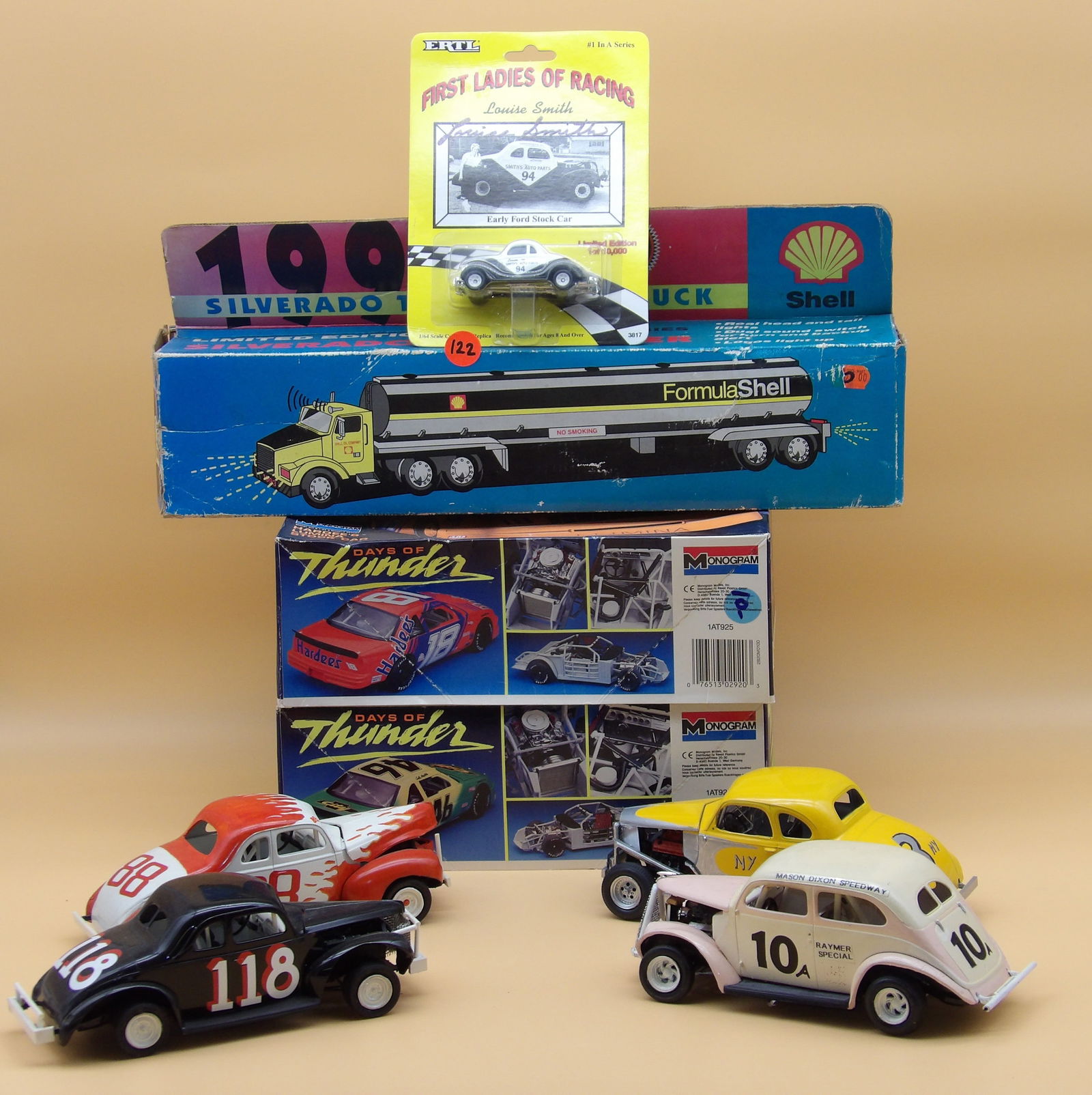 Die Cast & Model Race Car Lot: This racecar lot includes Days of Thunder Hardee's Lumina model kit, Days of Thunder City Chevrolet model kit, Shell Silverado Toy Tanker (in box), 4 custom hot rod model cars, and an AUTOGRAPHED Loui