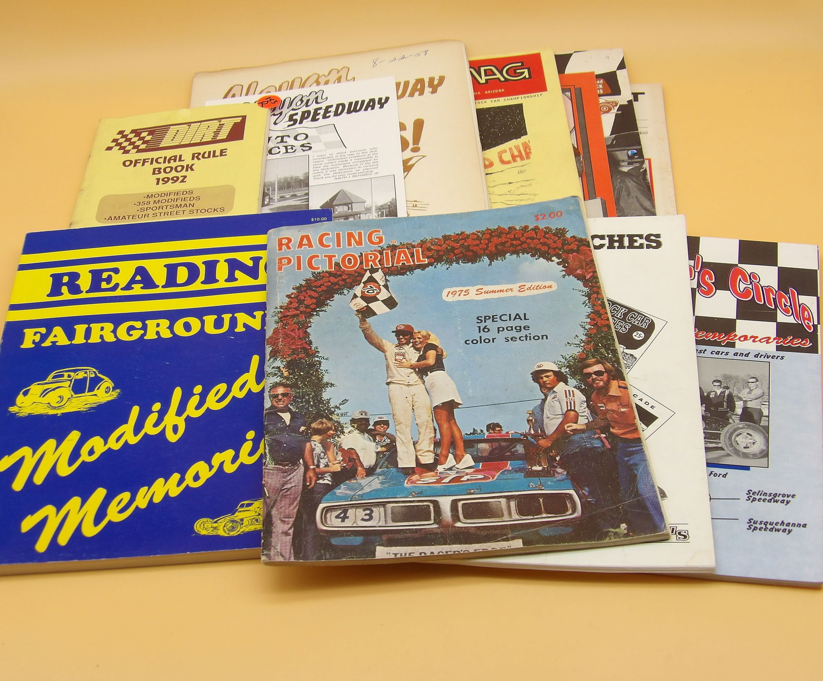Vintage Racing Magazines / Programs / Books (13 pcs): This lot of vintage racing magazines / programs / books includes American Racing Drivers Club (1988), Racing Pictorial (1975), The Winner's Circle (History 50's - 60's), Coupes & Coaches (racing in th
