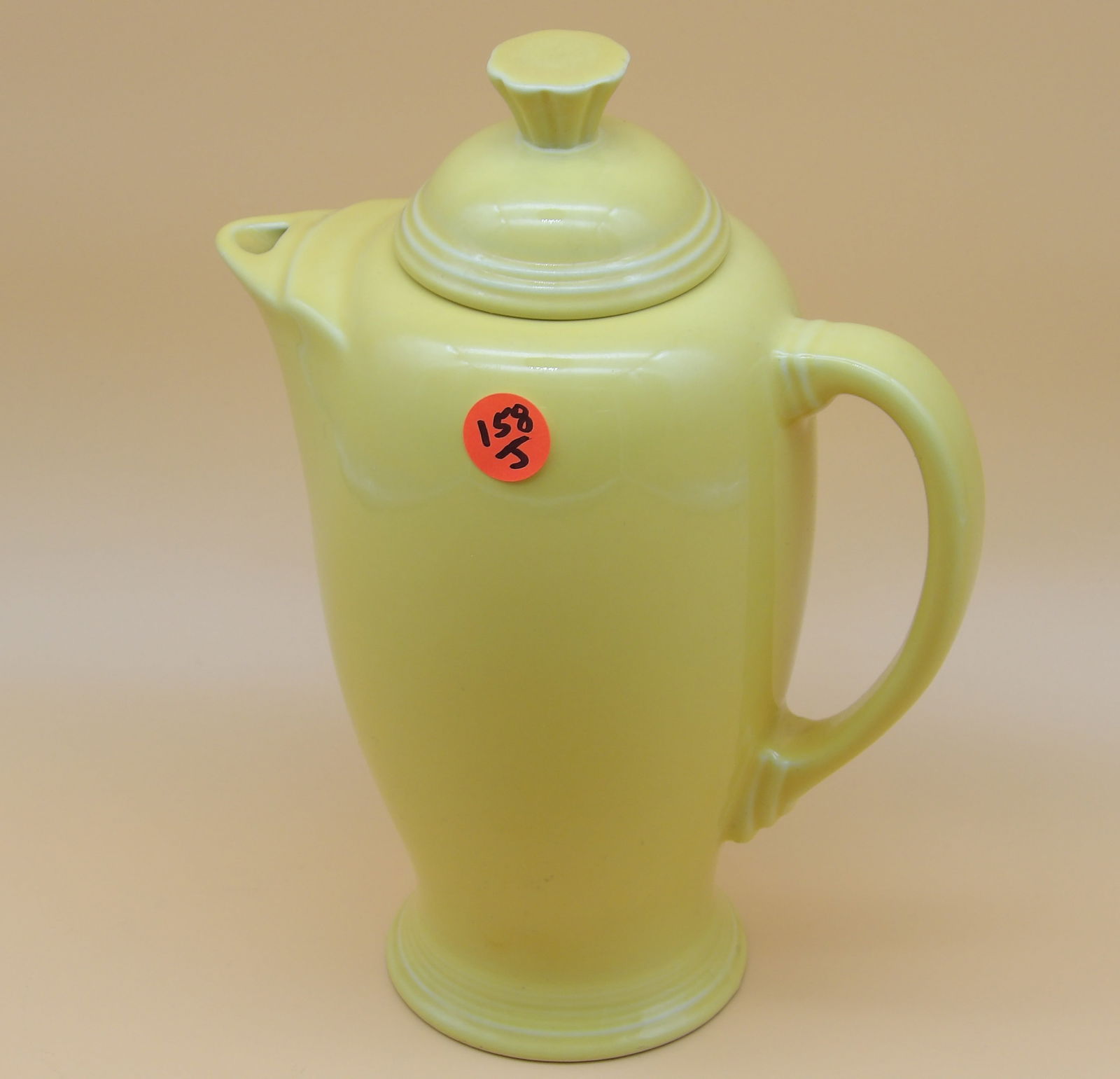 Fiesta Covered Coffee Server: This Fiesta covered coffee server comes in Sunflower Yellow and was discontinued in the 1990's. Measures 9" x 7" x 4"