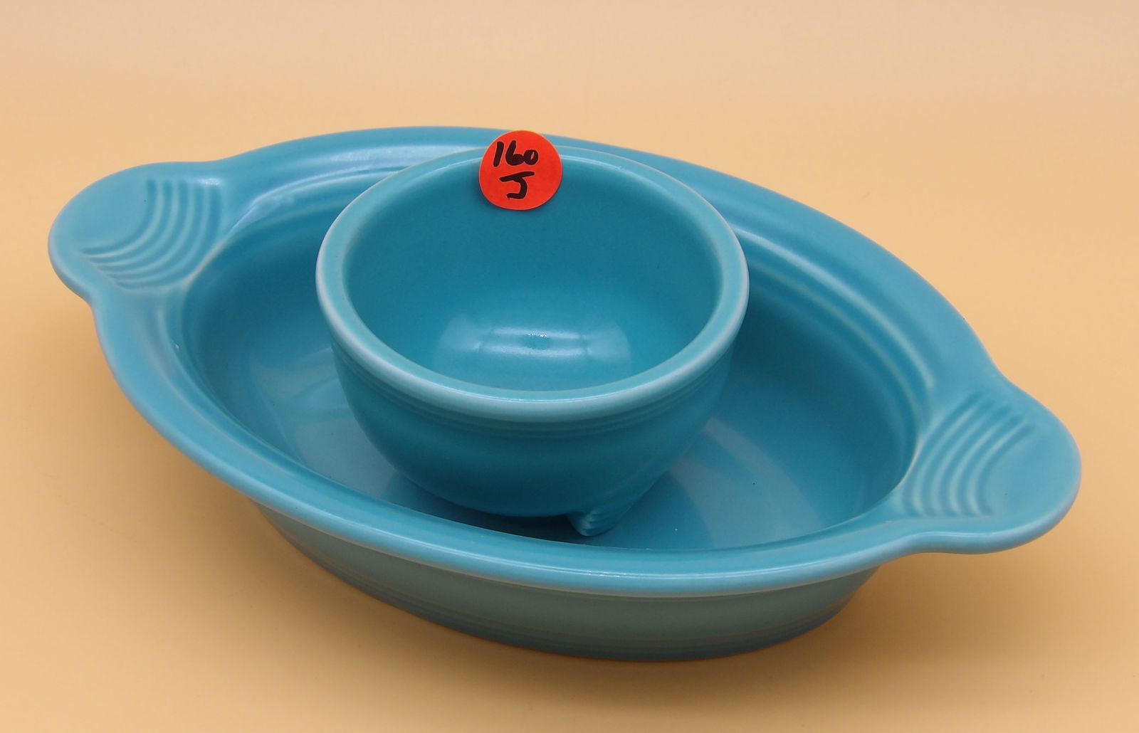 Fiesta Oval Casserole Dish & Salsa Bowl: This lot includes a Fiestaware oval casserole dish and salsa bowl in Turquoise glaze. Measures 9.5" x 6" x 2" and 2" x 3.5".