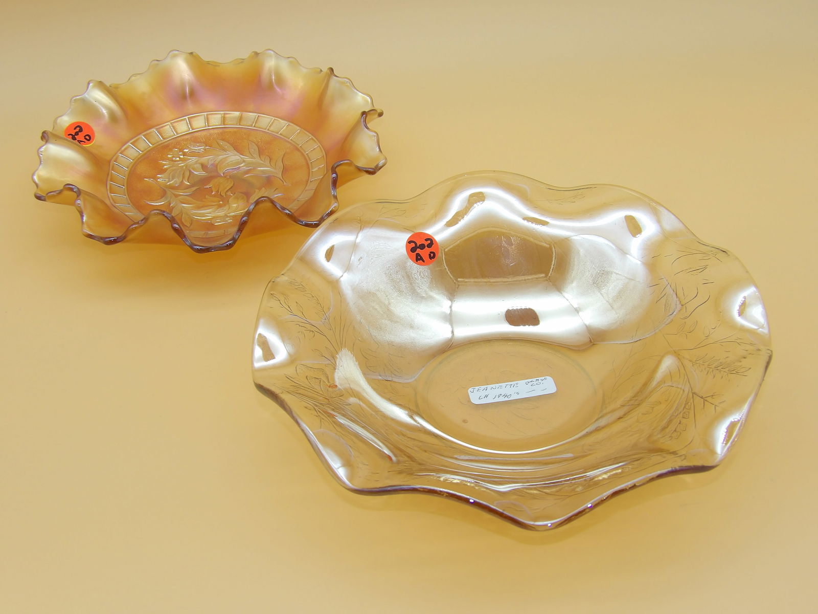 Dugan Windflower Ruffled Edge Bowl & Jeanette Glass Floragold Louisa Ruffled Bowl: This lovely glass duo includes a Dugan 'Windflower' ruffled-edge bowl (2.5" x 8.5"), and a Jeanette Glass Floragold 'Louisa' ruffled bowl (2.5" x 10")