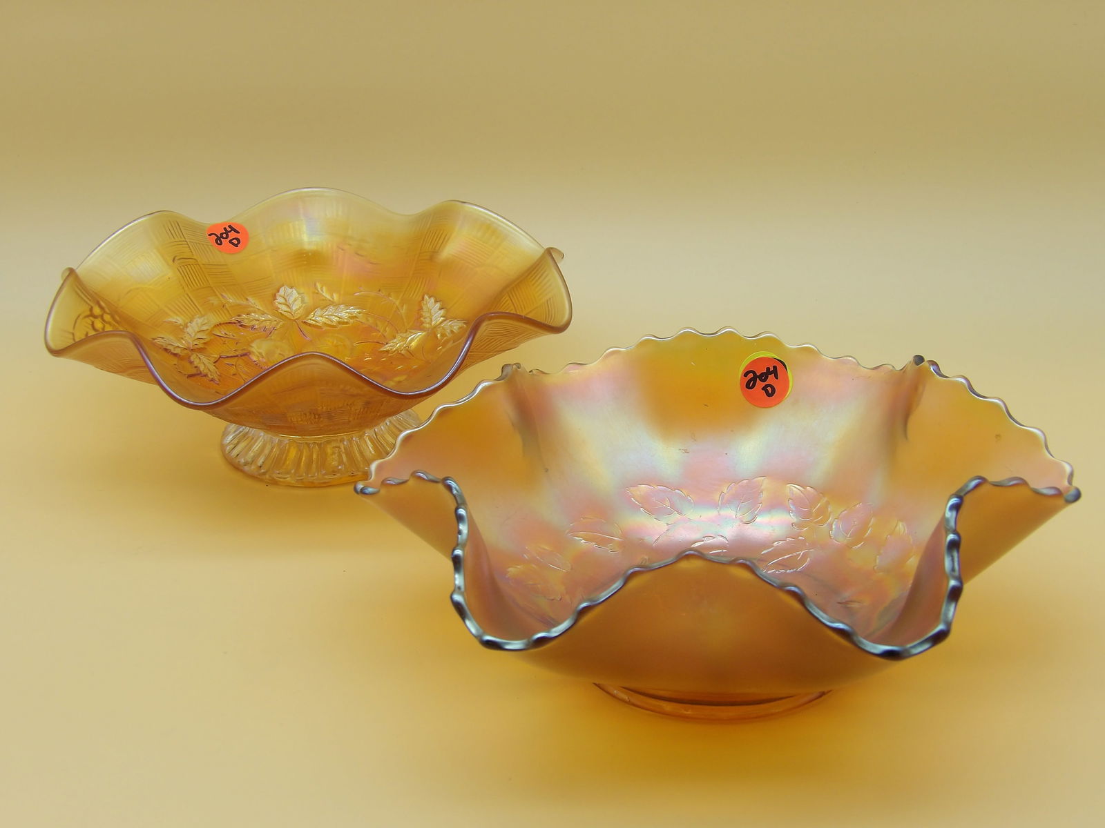 Dugan & Diamond Cosmos Variant Marigold Ruffled Fruit Bowl, Northwood 3 Fruits Ruffled Edge Bowl: This lovely glass duo includes a Dugan & Diamond 'Cosmos Variant' Marigold ruffled fruit bowl (3" x 9.5") and a Northwood '3 Fruits' ruffled edge bowl (3" x 8.5")