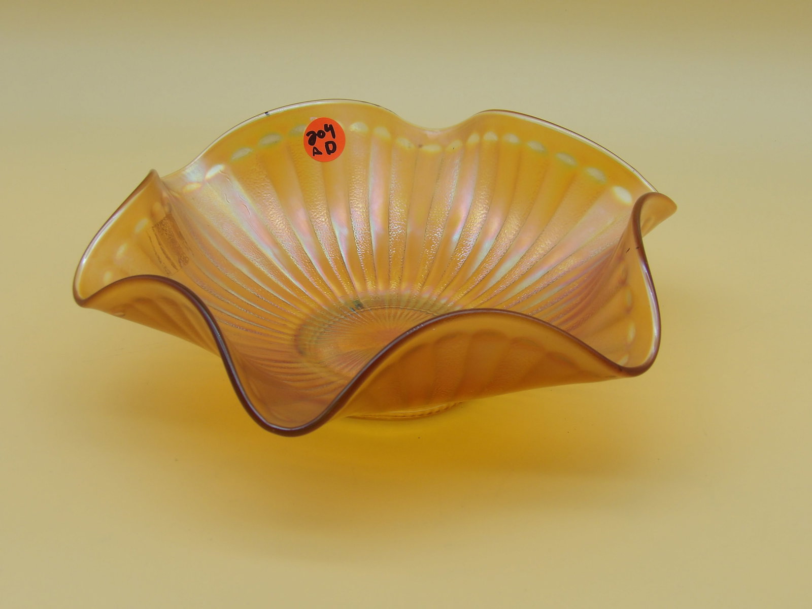 Fenton Marigold Stippled Rays Bowl: This vibrant Fenton Marigold 'Stippled Rays' bowl measures 3" x 9.5". Early 20th Century