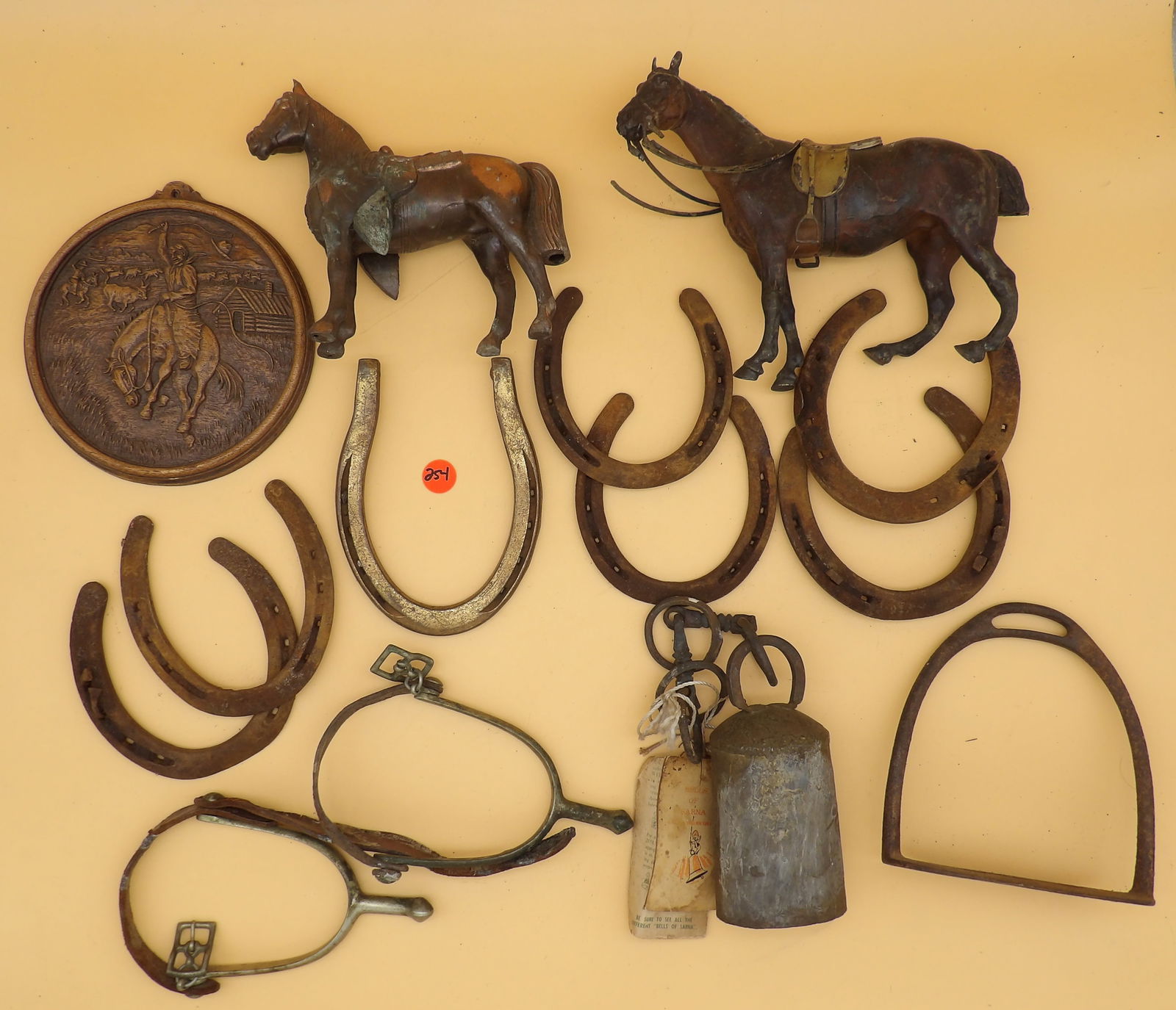 Horse Shoes (7), Brass Horses (2), Calvary Spurs (2), Strirrup, "Bells of Sarna" Cowbell, Cowboy (1 of 9)