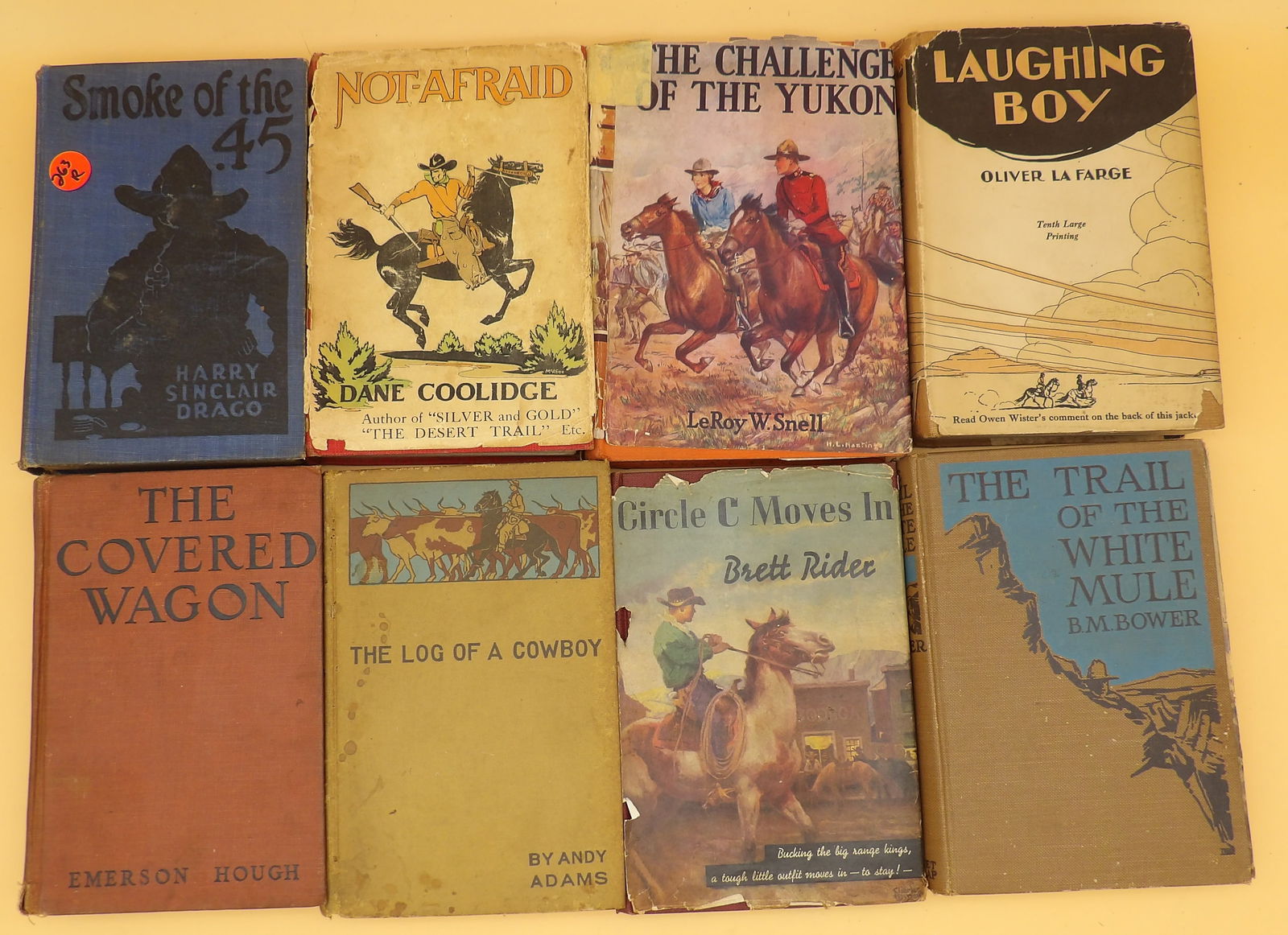Hardcover Western Books (12): Get ready for adventure with this lot of 12 vintage hardcover Western books from authors like Zane Grey, Adams, Snell, Draco, Craigie, and more. 1930's-1940's. Box measures 18" x 13"