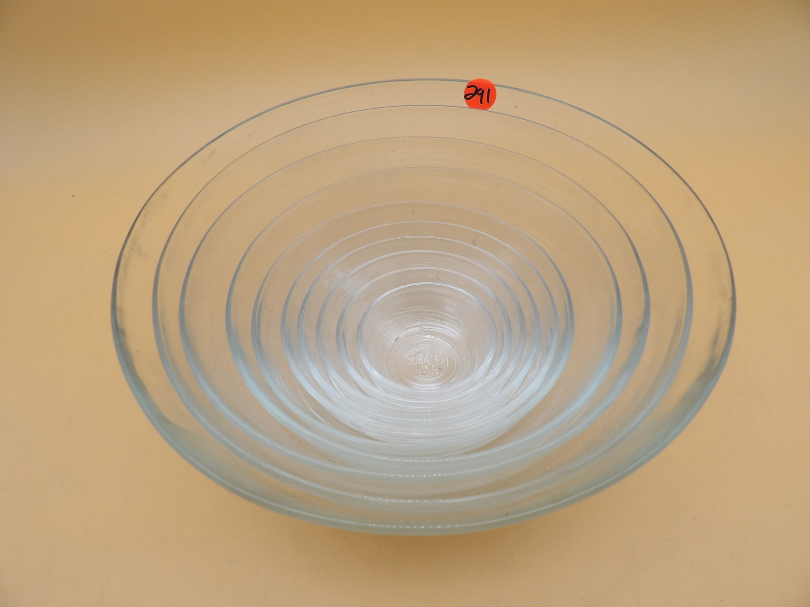 Duralex Nesting Mixing Bowl Set (10 pcs): This set of Duralex Nesting Mixing Bowls features 10 glass bowls of incrimental size that 'nest' inside eachother for storage. Largest measures 10" x 4". Mid 20th Century